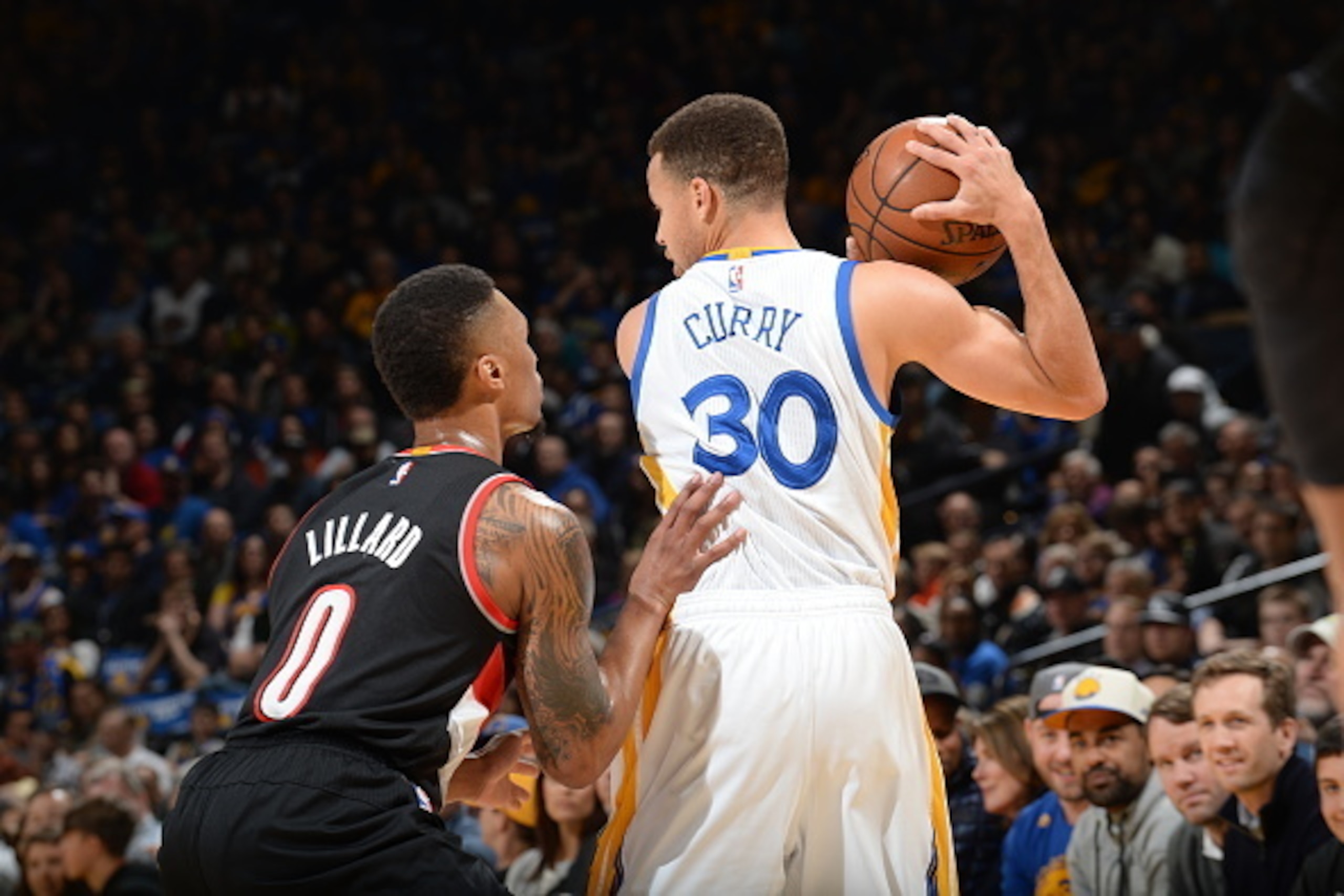 OAKLAND, CA - MARCH 11:  Stephen Curry #30 of the Golden State Warriors handles the ball against Damian Lillard #0 of the Portland Trail Blazers on March 11, 2016 at Oracle Arena in Oakland, California. NOTE TO USER: User expressly acknowledges and agrees