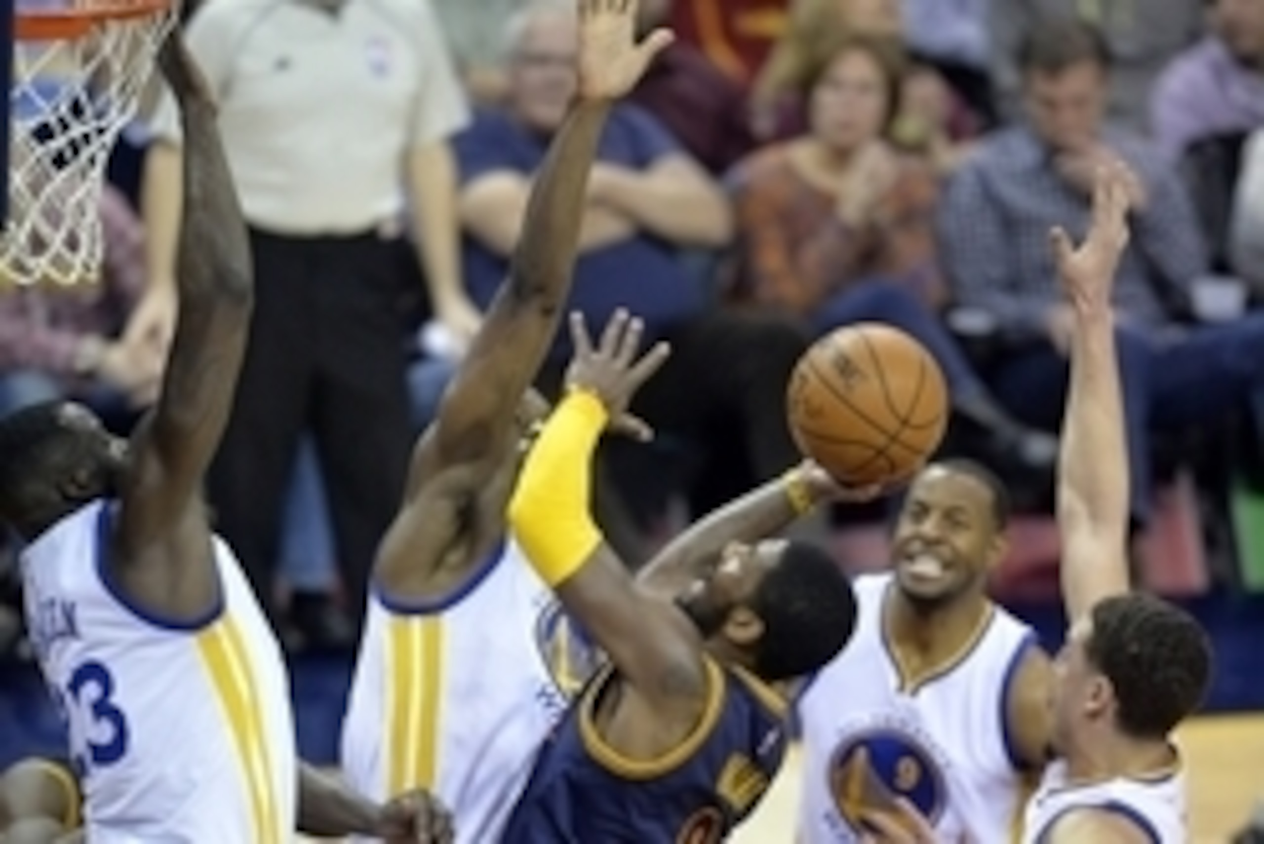 Feb 26, 2015; Cleveland, OH, USA; Cleveland Cavaliers guard Kyrie Irving (2) drives against the Golden State Warriors defense in the third quarter at Quicken Loans Arena. Mandatory Credit: David Richard-USA TODAY Sports