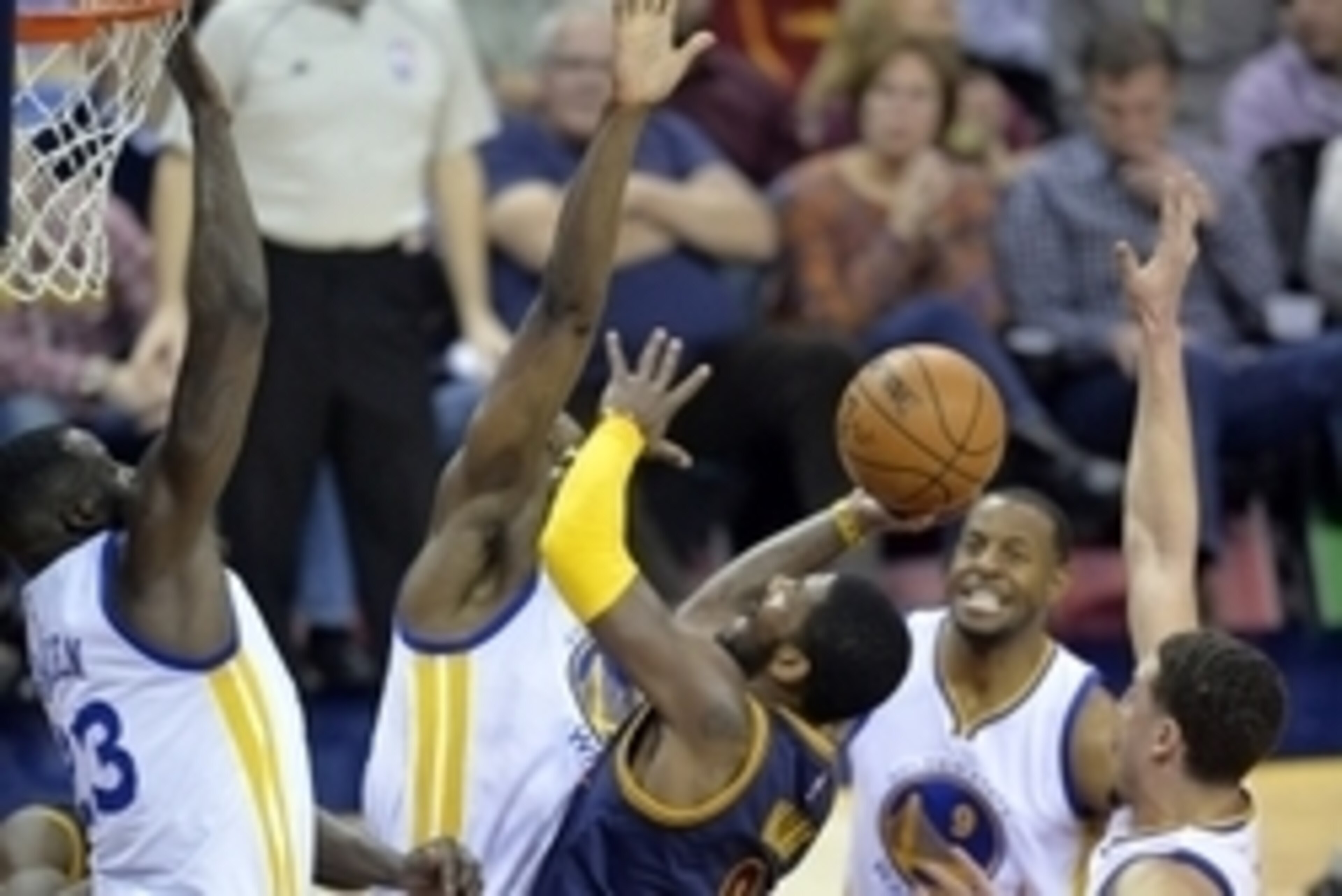 Feb 26, 2015; Cleveland, OH, USA; Cleveland Cavaliers guard Kyrie Irving (2) drives against the Golden State Warriors defense in the third quarter at Quicken Loans Arena. Mandatory Credit: David Richard-USA TODAY Sports