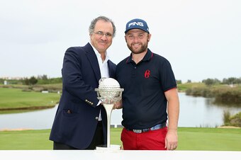 ALBUFEIRA, PORTUGAL - OCTOBER 18:  Andy Sullivan of England poses with the trophy alongside Antonio Pires De Lima, Minister Of Economy, after winning the Portugal Masters at Oceanico Victoria Golf Club on October 18, 2015 in Albufeira, Portugal.  (Photo b