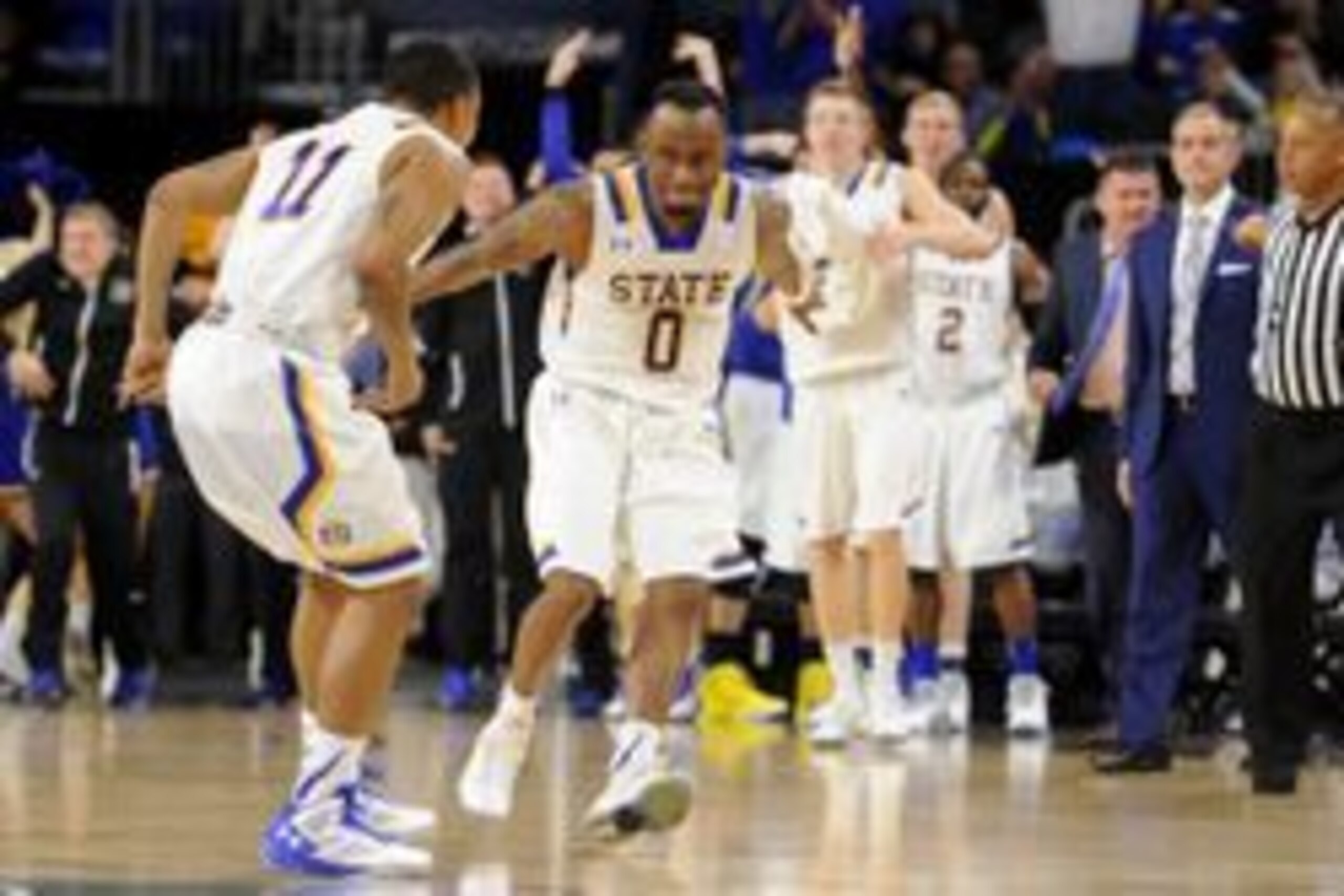 Mar 8, 2016; Sioux Falls, SD, USA; South Dakota State Jackrabbits guard Deondre Parks (0) and guard George Marshall (11) celebrate in late game action against the North Dakota State Bison during the second half of the Summit Conference tournament at Denny