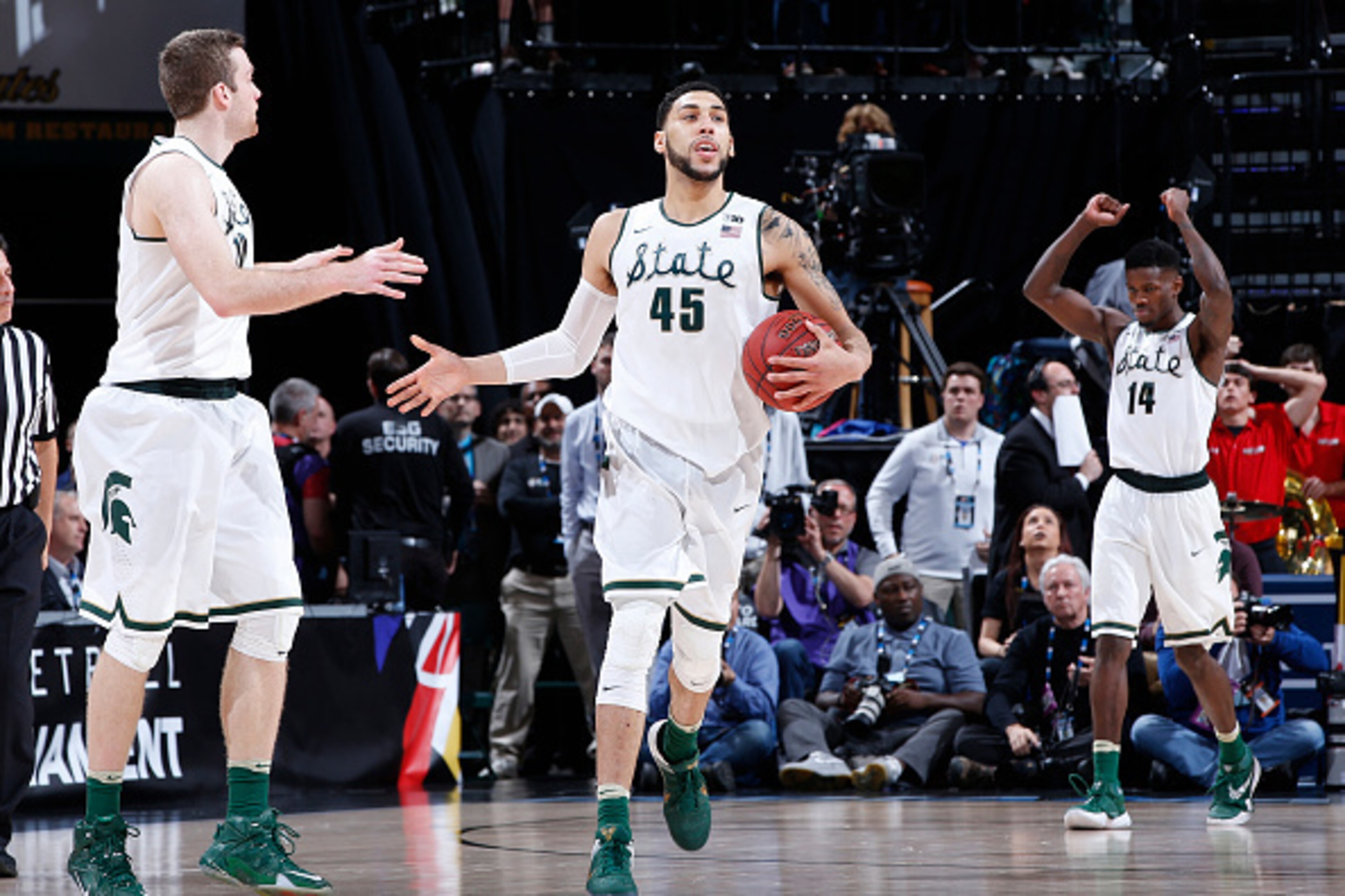 INDIANAPOLIS, IN - MARCH 12: Denzel Valentine #45 and Matt Costello #10 of the Michigan State Spartans celebrate after defeating the Maryland Terrapins in the semifinals of the Big Ten Basketball Tournament at Bankers Life Fieldhouse on March 12, 2016 in 