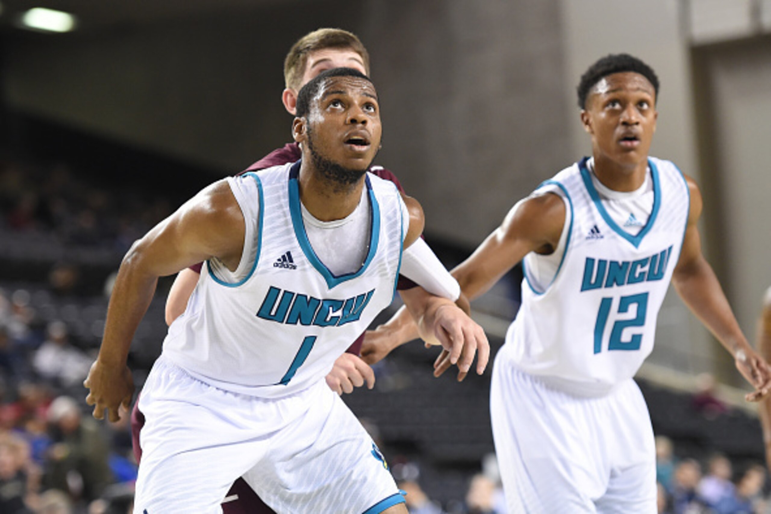BALTIMORE, MD - MARCH 05: Chris Flemmings #1 of the North Carolina-Wilmington Seahawks protects the lane during the quarterfinals of the Colonial Athletic Conference Tournament college basketball game against the Charleston Cougars at Royal Farms Arena o BALTIMORE, MD - MARCH 05: Chris Flemmings #1 of the North Carolina-Wilmington Seahawks protects the lane during the quarterfinals of the Colonial Athletic Conference Tournament college basketball game against the Charleston Cougars at Royal Farms Arena o