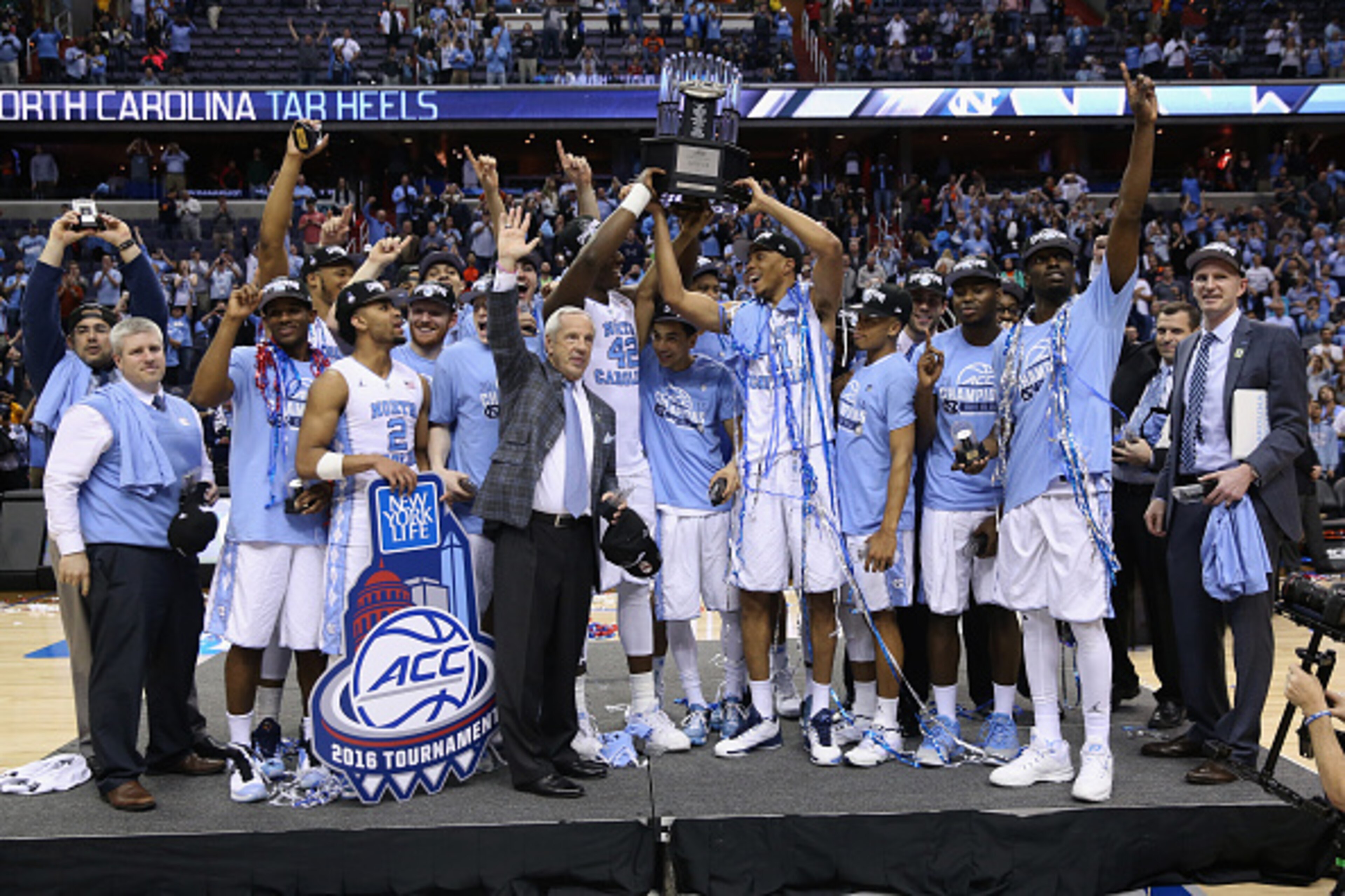 WASHINGTON, DC - MARCH 12:  The North Carolina Tar Heels hold up the conference trophy after defeating the Virginia Cavaliers 61-57 to win the 2016 ACC Basketball Tournament at Verizon Center on March 12, 2016 in Washington, DC.  (Photo by Rob Carr/Getty 