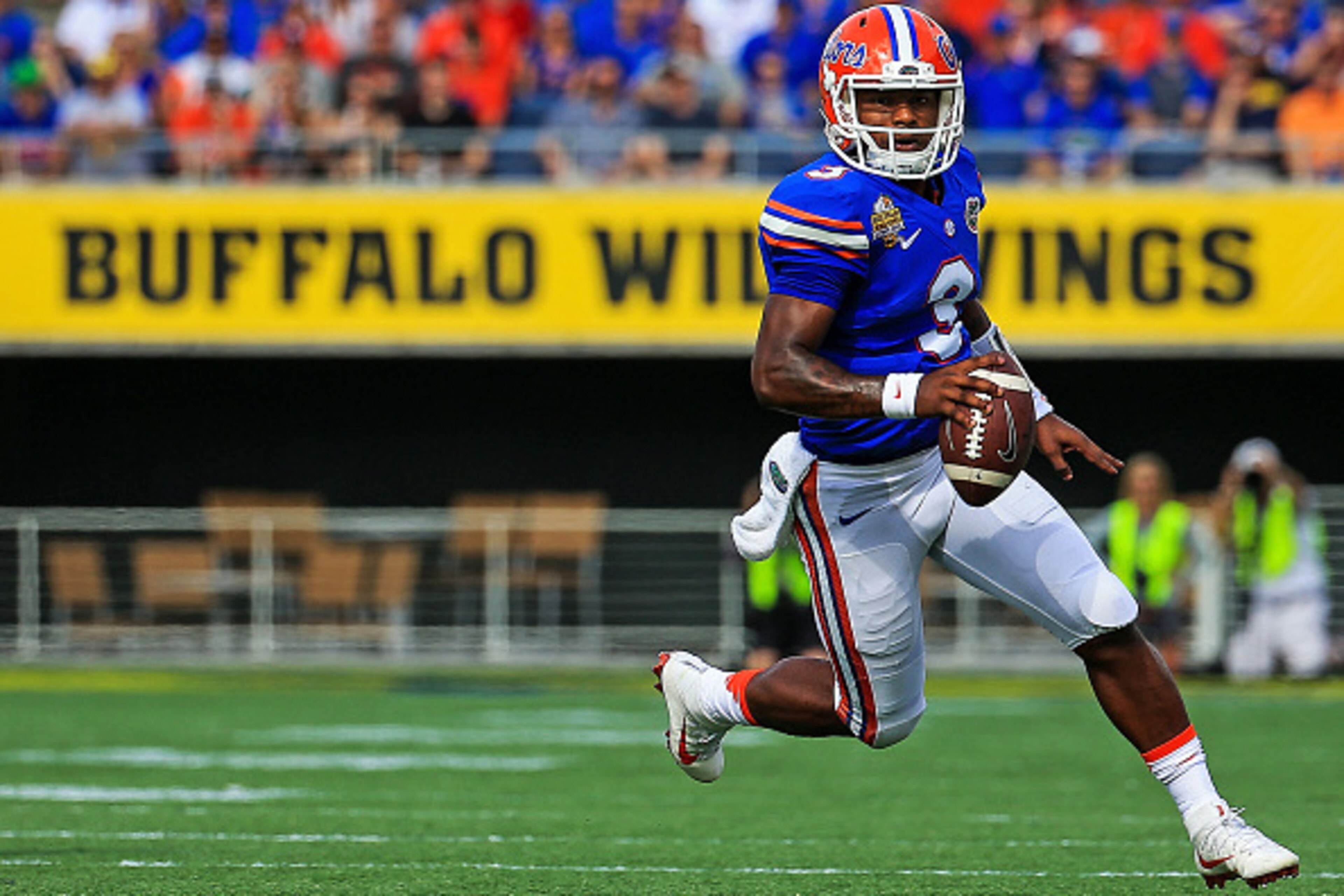 ORLANDO, FL - JANUARY 01: Treon Harris #3 of the Florida Gators carries during the first half of the Buffalo Wild Wings Citrus Bowl game against the Michigan Wolverines at Orlando Citrus Bowl on January 1, 2016 in Orlando, Florida.  (Photo by Rob Foldy/Ge