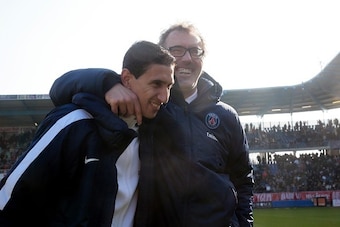 Paris Saint-Germain's French head coach Laurent Blanc (R) celebrates with Argentinian midfielder Angel Di Maria after winning over Troyes during the French Ligue 1 football match on March 13, 2016 at the Aube Stadium in Troyes.
Paris Saint-Germain clinche