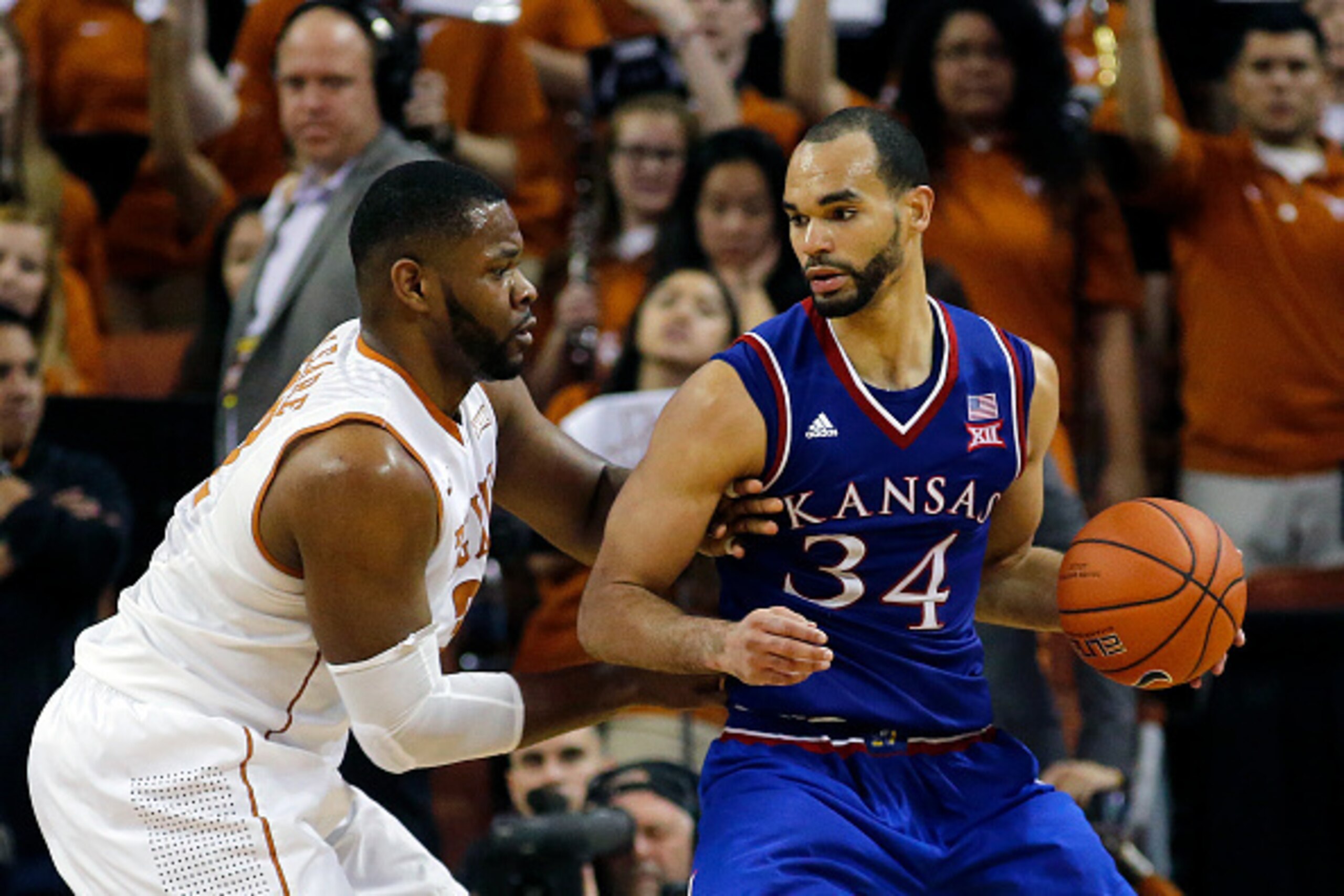 AUSTIN, TX - FEBRUARY 29: Perry Ellis #34 of the Kansas Jayhawks moves with the ball against Shaquille Cleare #32 of the Texas Longhorns at the Frank Erwin Center on February 29, 2016 in Austin, Texas. (Photo by Chris Covatta/Getty Images)