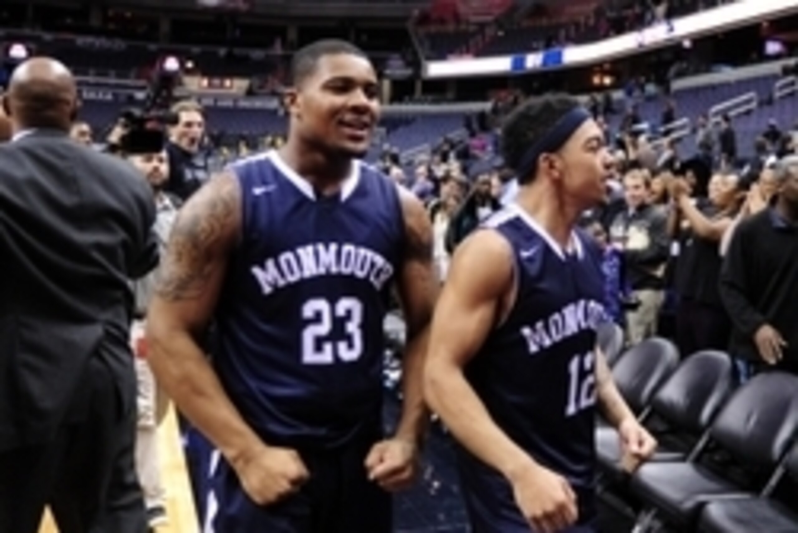 Dec 15, 2015; Washington, DC, USA; Monmouth Hawks guard Austin Tilghman (23) and guard Justin Robinson (12) celebrate after beating the Georgetown Hoyas 83-68 at Verizon Center. Mandatory Credit: Evan Habeeb-USA TODAY Sports Dec 15, 2015; Washington, DC, USA; Monmouth Hawks guard Austin Tilghman (23) and guard Justin Robinson (12) celebrate after beating the Georgetown Hoyas 83-68 at Verizon Center. Mandatory Credit: Evan Habeeb-USA TODAY Sports