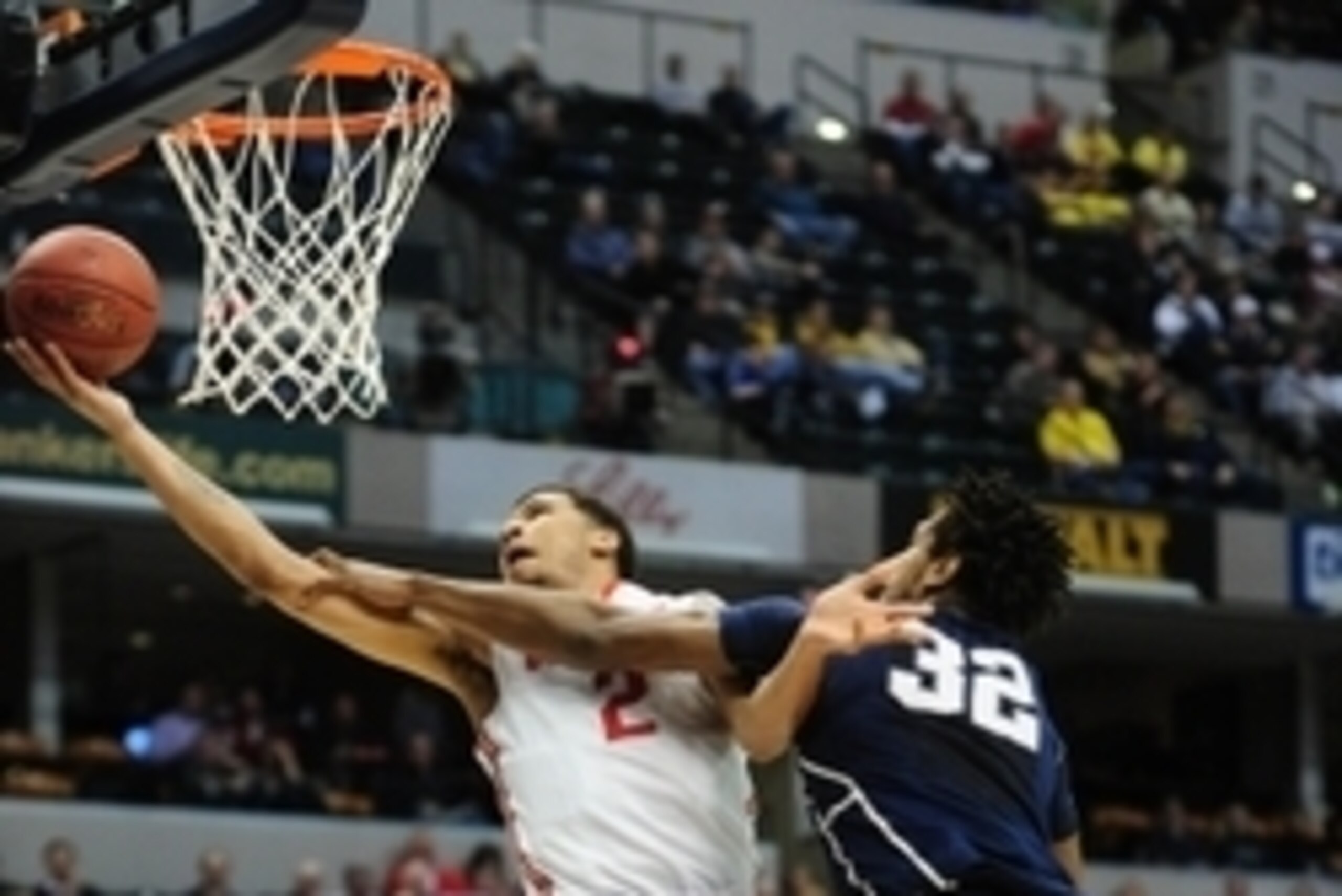 Mar 10, 2016; Indianapolis, IN, USA; Ohio State Buckeyes forward Marc Loving (2) scores past Penn State Nittany Lions center Jordan Dickerson (32) in the first half during the Big Ten Conference tournament at Bankers Life Fieldhouse. Mandatory Credit: Tho Mar 10, 2016; Indianapolis, IN, USA; Ohio State Buckeyes forward Marc Loving (2) scores past Penn State Nittany Lions center Jordan Dickerson (32) in the first half during the Big Ten Conference tournament at Bankers Life Fieldhouse. Mandatory Credit: Tho