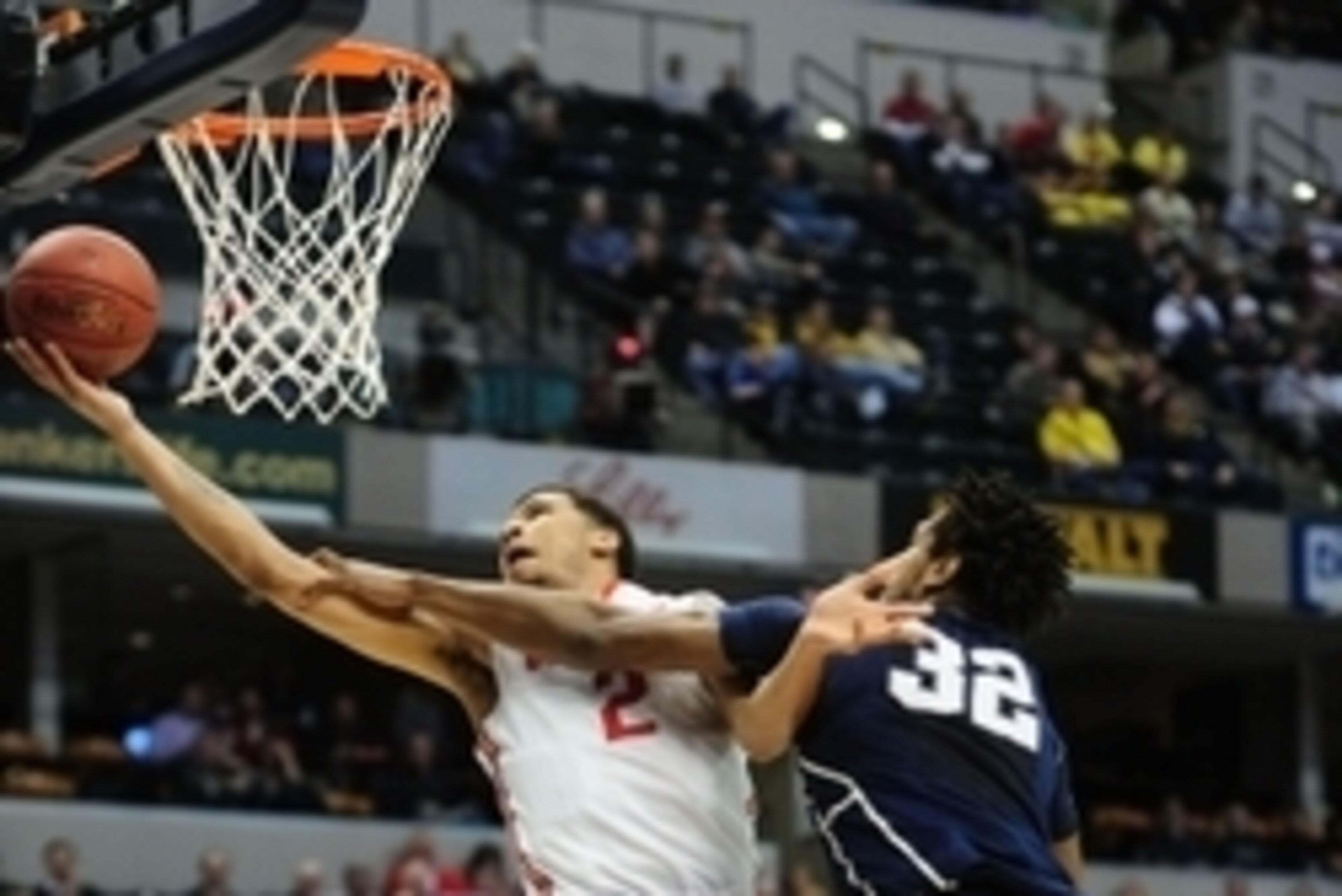 Mar 10, 2016; Indianapolis, IN, USA; Ohio State Buckeyes forward Marc Loving (2) scores past Penn State Nittany Lions center Jordan Dickerson (32) in the first half during the Big Ten Conference tournament at Bankers Life Fieldhouse. Mandatory Credit: Tho