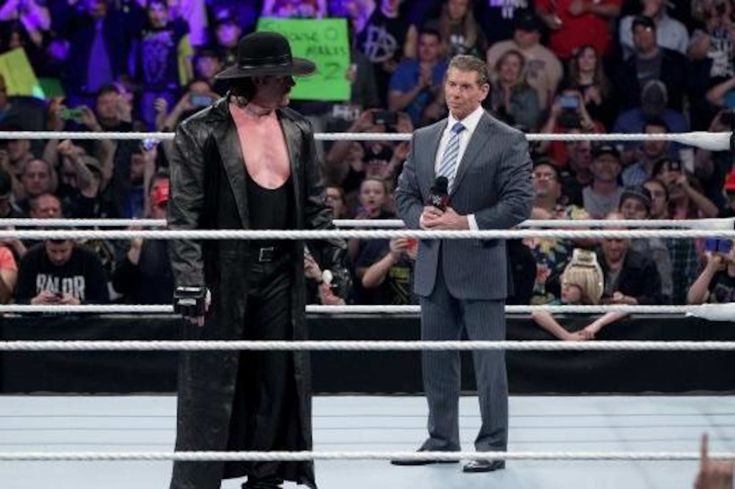Undertaker stares down Vince McMahon.
