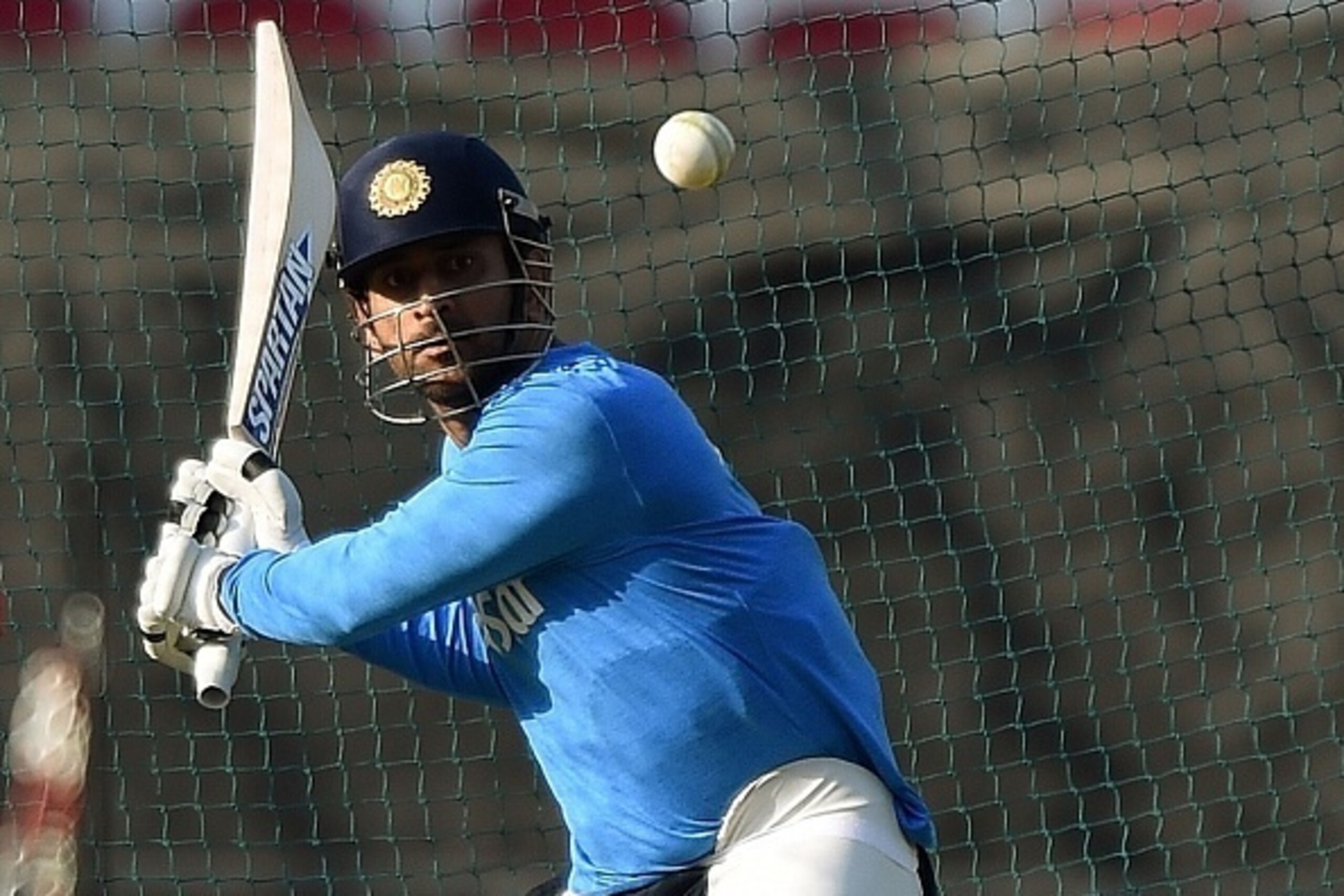 India's captain Mahendra Singh Dhoni plays a shot during the training session at The Vidarbha Cricket Association Stadium in Nagpur on March 14, 2016. 
 India plays against New Zealand in the World T20 cricket tournament on March 15 in Nagpur. / AFP / PUN