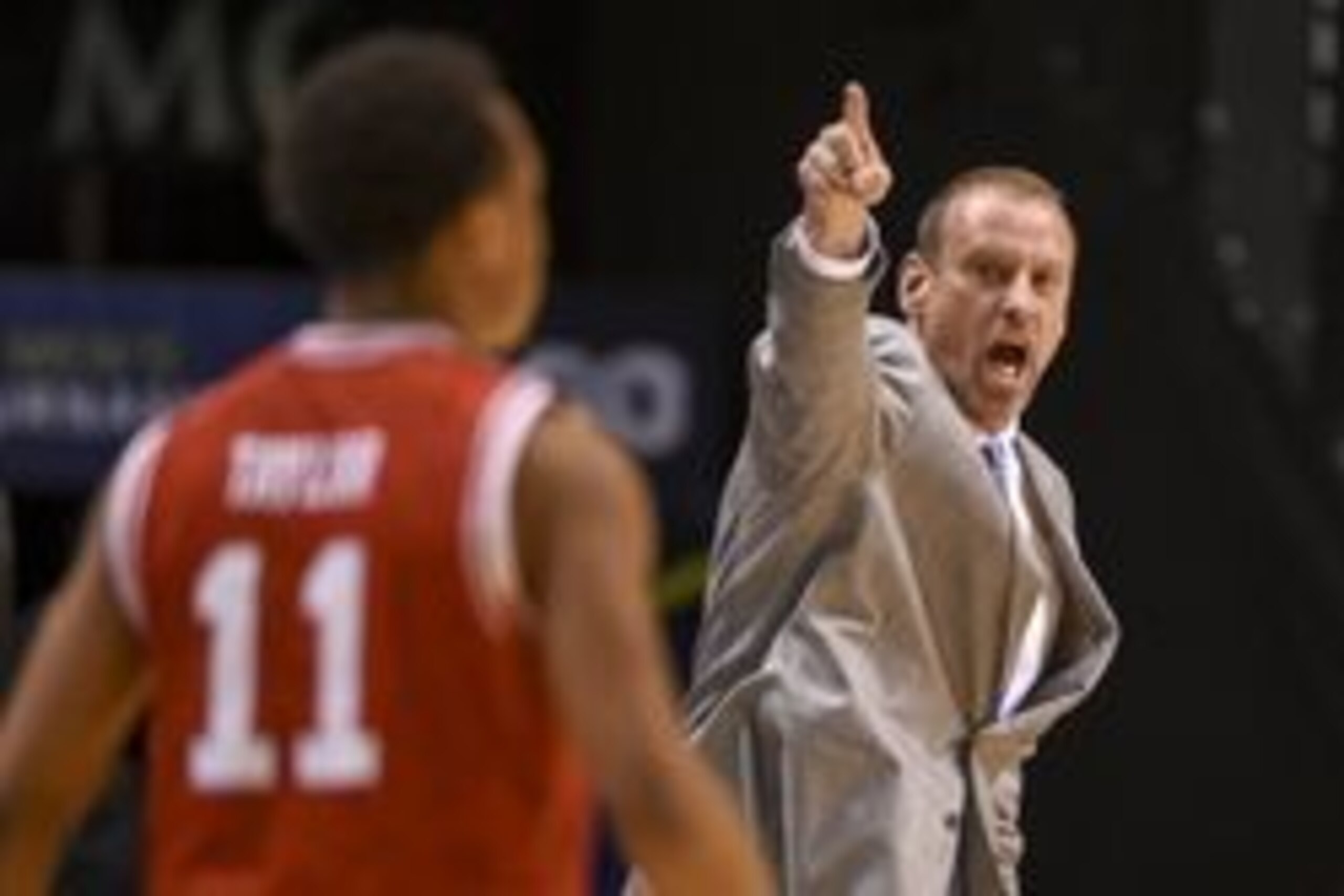 March 12, 2016; Las Vegas, NV, USA; Utah Utes head coach Larry Krystkowiak (right) instructs in front of guard Brandon Taylor (11) during the first half in the championship game of the Pac-12 Conference tournament against the Oregon Ducks at MGM Grand Gar