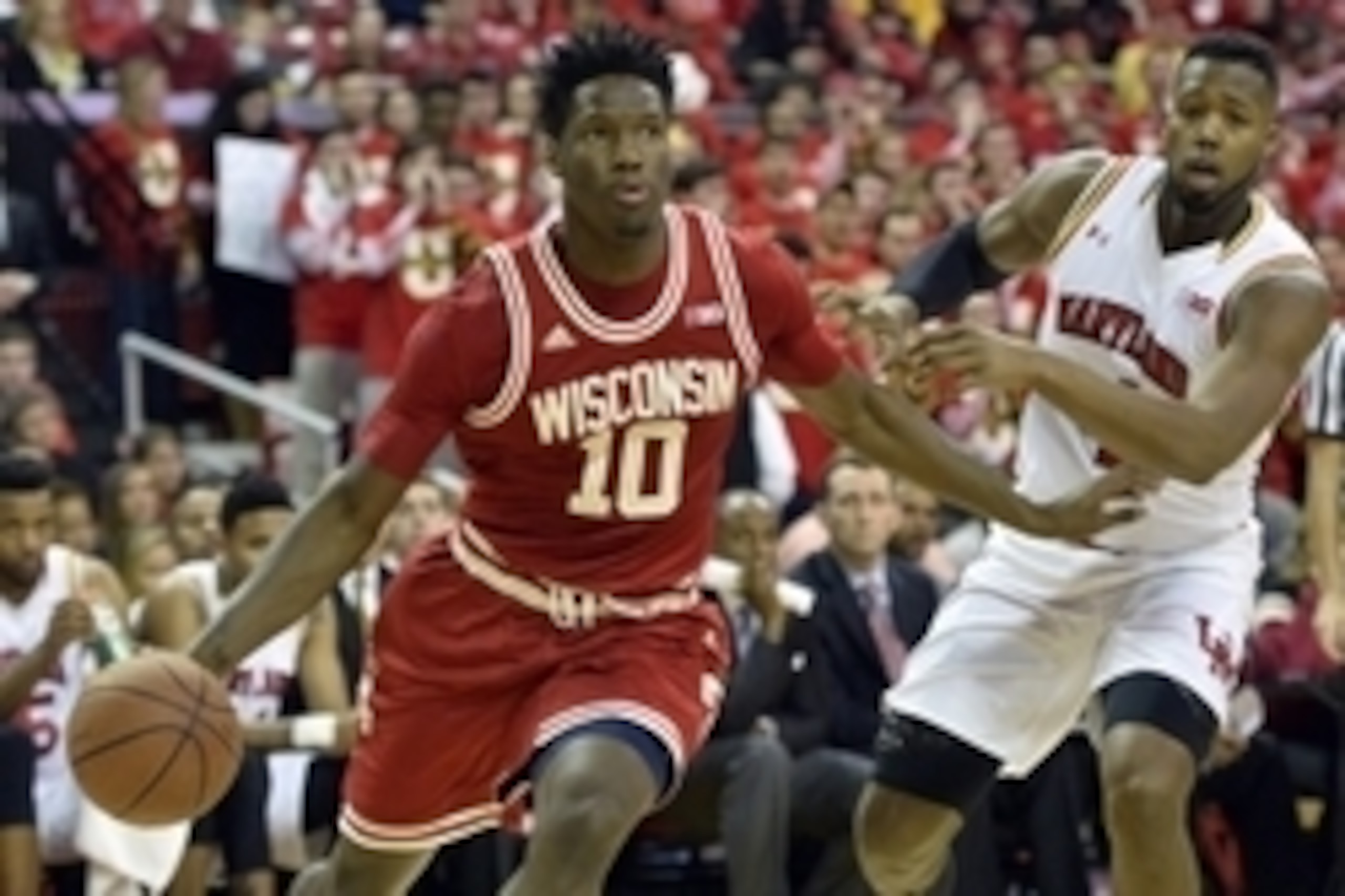 Feb 13, 2016; College Park, MD, USA; Wisconsin Badgers forward Nigel Hayes (10) drives to the basket as Maryland Terrapins forward Robert Carter (4) defends during the first half at Xfinity Center. Mandatory Credit: Tommy Gilligan-USA TODAY Sports