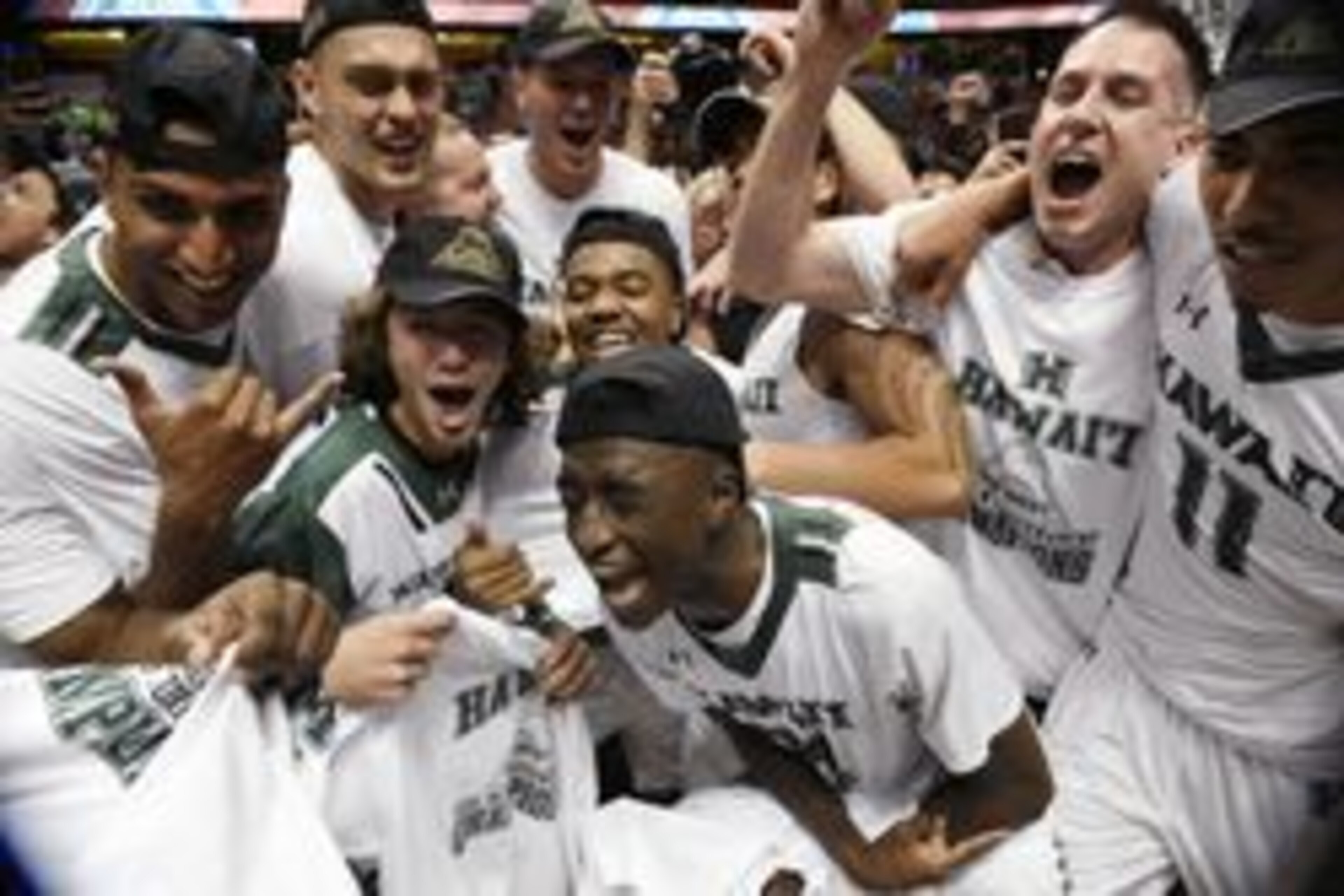 Mar 12, 2016; Anaheim, CA, USA; Hawaii Rainbow Warriors players celebrate after the championship game of the Big West conference tournament against the Long Beach State 49ers at Honda Center. Hawaii won 64-60. Mandatory Credit: Kelvin Kuo-USA TODAY Sports