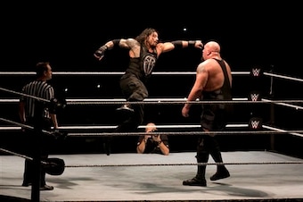 Roman Reigns hits Big Show with a Superman Punch.