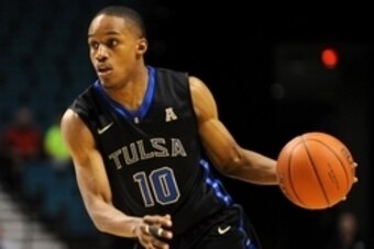 Nov 24, 2014; Las Vegas, NV, USA; Tulsa Golden Hurricane guard James Woodard (10) dribbles the ball during an NCAA basketball game against Auburn at MGM Grand. Mandatory Credit: Stephen R. Sylvanie-USA TODAY Sports