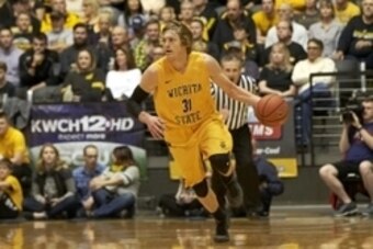 Feb 18, 2016; Wichita, KS, USA; Wichita State Shockers guard Ron Baker (31) brings the ball down the court against the Missouri State Bears at Charles Koch Arena. Mandatory Credit: Gary Rohman/MLS/USA TODAY Sports