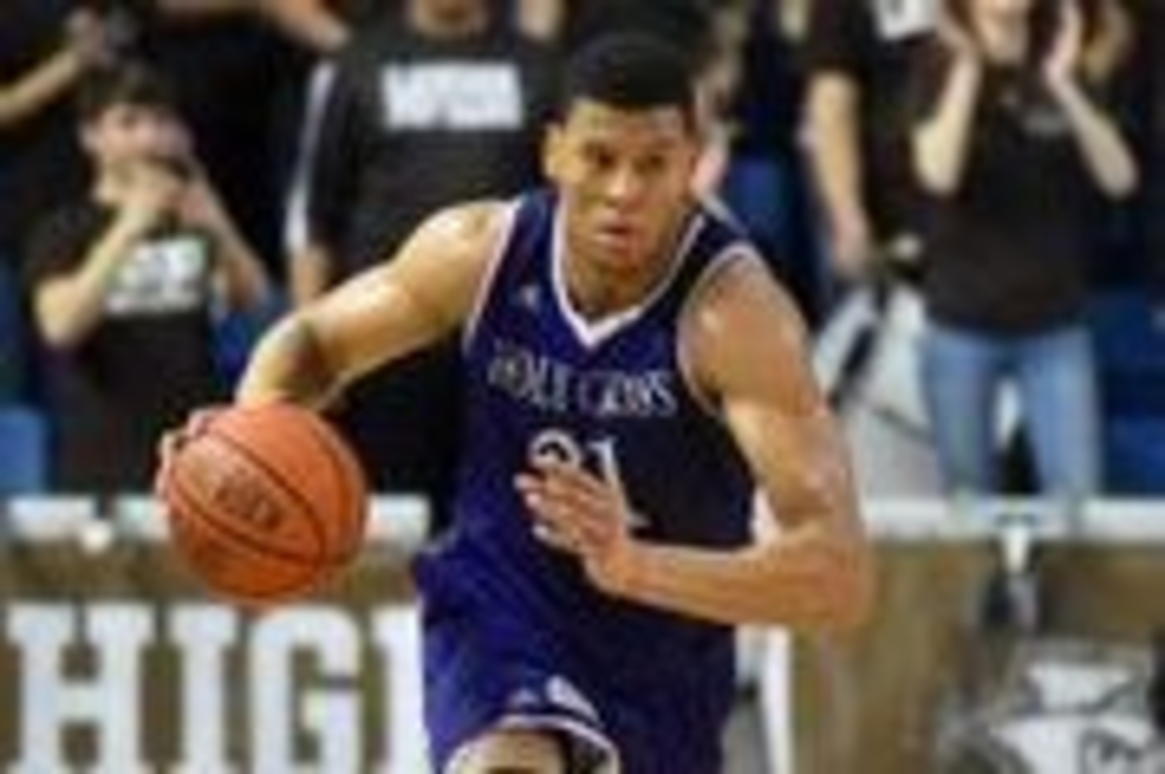Mar 9, 2016; Bethlehem, PA, USA; Holy Cross Crusaders forward Malachi Alexander (21) dribbles in the second hal against the Lehigh Mountain Hawks during the Patriot League final at Stabler Arena. Holy Cross won 59-56. Mandatory Credit: James Lang-USA TODA