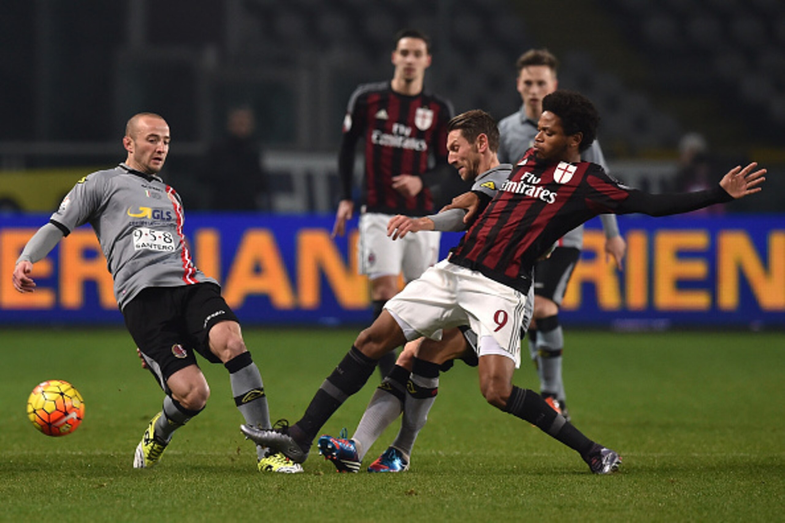 TURIN, ITALY - JANUARY 26:  Massimo Loviso (C) of US Alessandria competes with Luiz Adriano of AC Milan during the TIM Cup match between US Alessandria and AC Milan at Olimpico Stadium on January 26, 2016 in Turin, Italy.  (Photo by Valerio Pennicino/Gett
