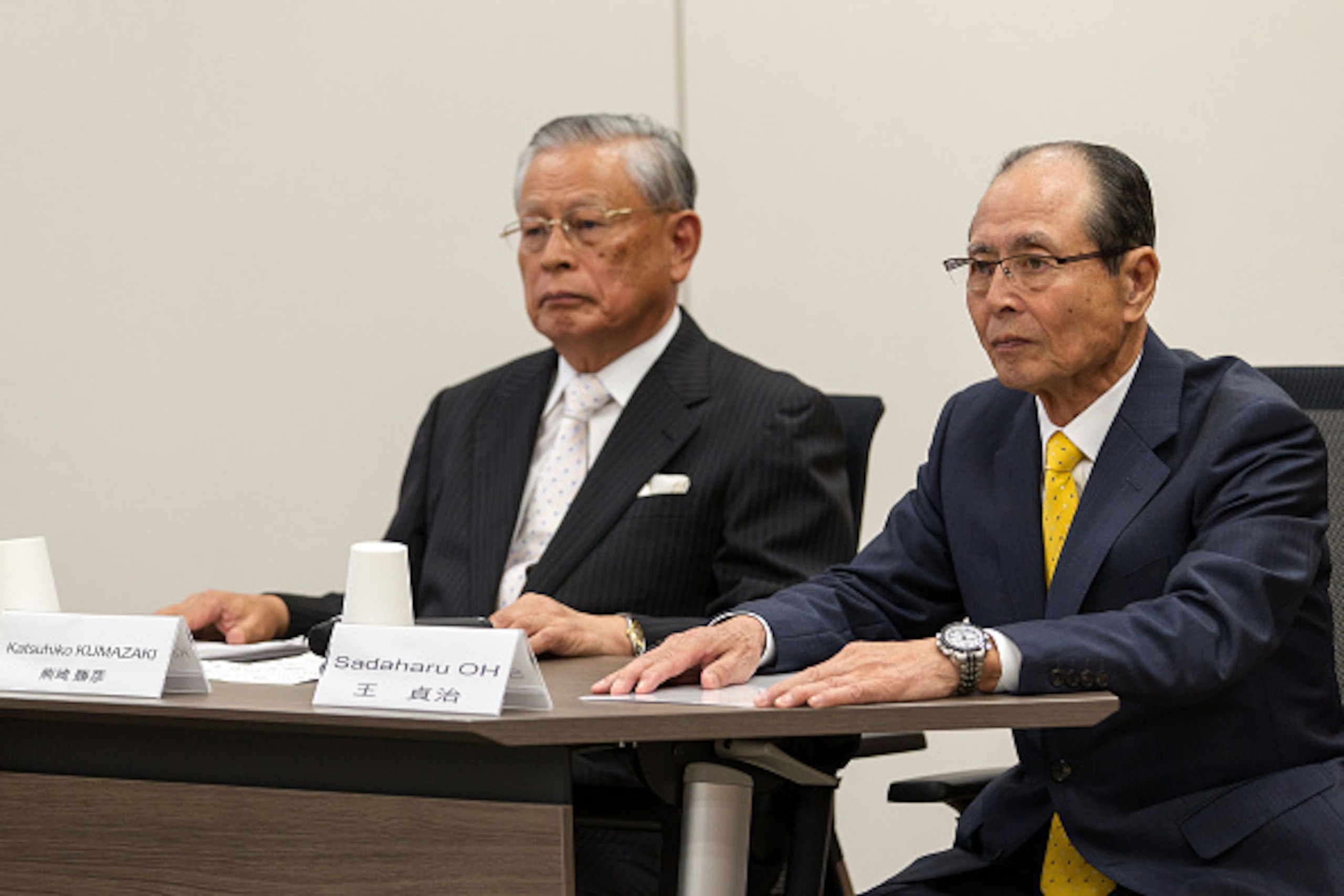TOKYO, JAPAN - AUGUST 07:  Katsuhiko Kumazaki (L), Nippon Professional Baseball Commissioner and Sadaharu Oh (R), Chairman of the World Children Baseball Fair of World Baseball Softball Confederation (WBSC) gives a presentation during the interview sessio