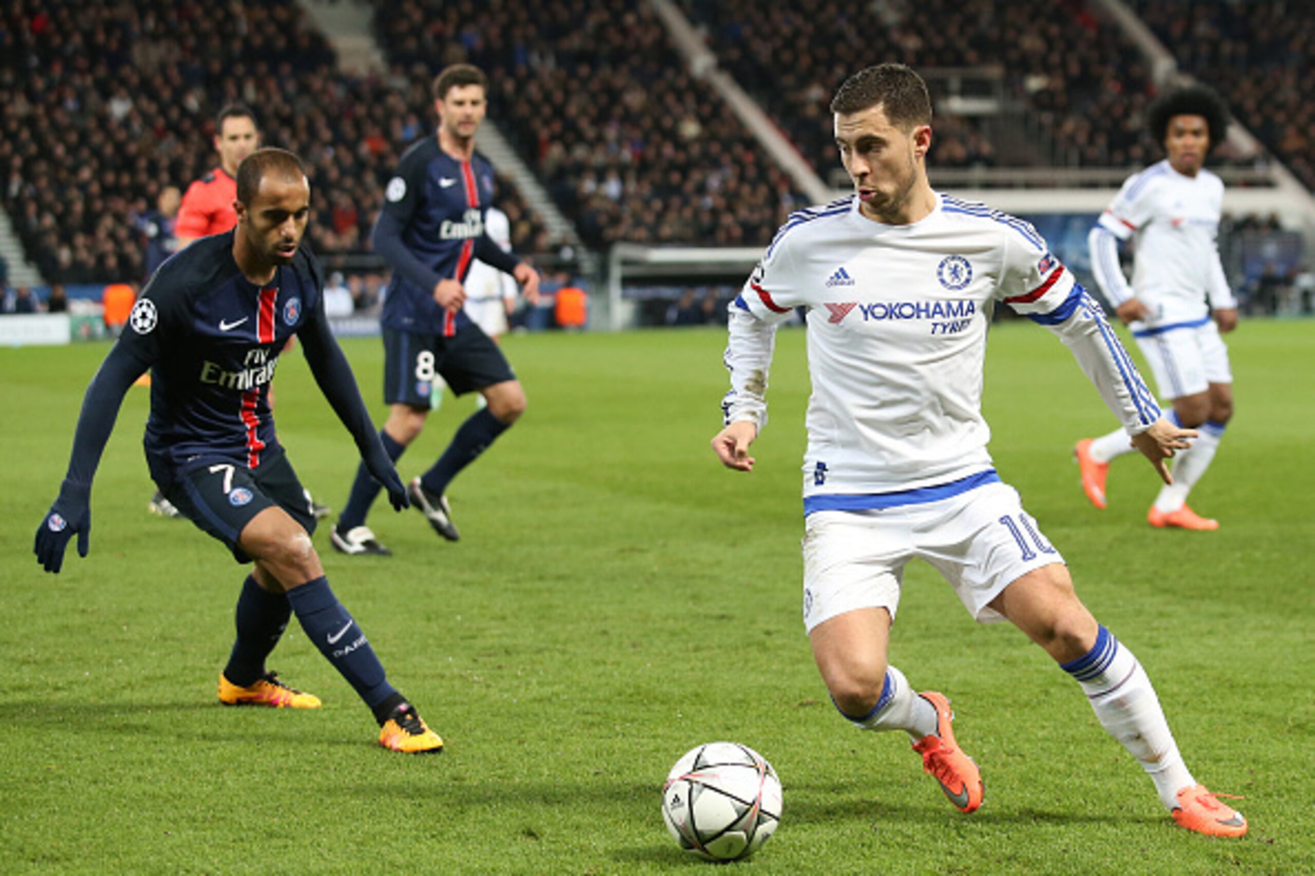 PARIS - FEBRUARY 16: Eden Hazard of Chelsea and Lucas Moura of PSG (left) in action during the UEFA Champions League round of 16 first leg match between Paris Saint-Germain (PSG) and Chelsea FC at Parc des Princes stadium on February 16, 2016 in Paris, Fr PARIS - FEBRUARY 16: Eden Hazard of Chelsea and Lucas Moura of PSG (left) in action during the UEFA Champions League round of 16 first leg match between Paris Saint-Germain (PSG) and Chelsea FC at Parc des Princes stadium on February 16, 2016 in Paris, Fr