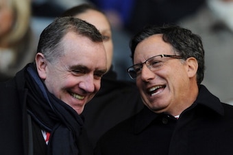 LIVERPOOL, ENGLAND - NOVEMBER 17:  Liverpool chairman Tom Werner (R) chats with managing director Ian Ayre prior to the Barclays Premier League match between Liverpool and Wigan Athletic at Anfield on November 17, 2012 in Liverpool, England.  (Photo by Ch