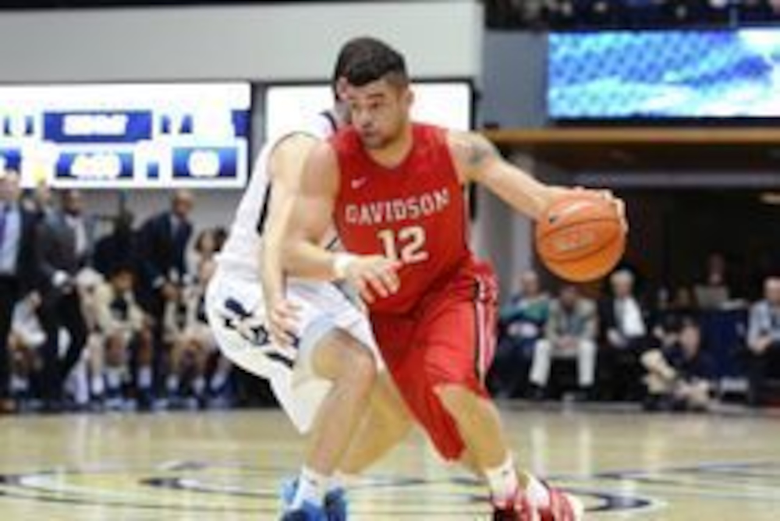 Feb 3, 2016; Washington, DC, USA; Davidson Wildcats guard Jack Gibbs (12) dribbles against the George Washington Colonials during the second half at Charles E. Smith Center. Mandatory Credit: Brad Mills-USA TODAY Sports