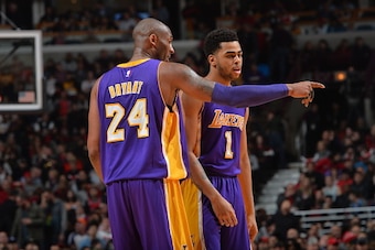CHICAGO, IL - FEBRUARY 21:  Kobe Bryant #24 of the Los Angeles Lakers gives direction to his teammate D'Angelo Russell #1 against the Chicago Bulls on February 21, 2016 at the United Center in Chicago, Illinois. NOTE TO USER: User expressly acknowledges a