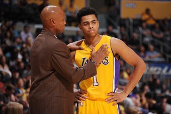 LOS ANGELES, CA - OCTOBER 11: Head coach, Byron Scott of the Los Angeles Lakers speaks with D'Angelo Russell #1  during the preseason game against the Maccabi Haifa on October 11, 2015 at STAPLES CENTER in Los Angeles, California. NOTE TO USER: User expre