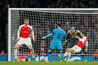 LONDON, ENGLAND - FEBRUARY 23: Lionel Messi of Barcelona is fouled by Mathieu Flamini of Arsenal for a penalty during the Champions League match between Arsenal and Barcelona at The Emirates Stadium on February 23, 2016 in London, United Kingdom. (Photo b