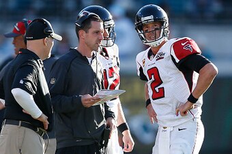 JACKSONVILLE, FL - DECEMBER 20: Matt Ryan #2 of the Atlanta Falcons talks to offensive coordinator Kyle Shanahan and head coach Dan Quinn during the game against the Jacksonville Jaguars at EverBank Field on December 20, 2015 in Jacksonville, Florida. The