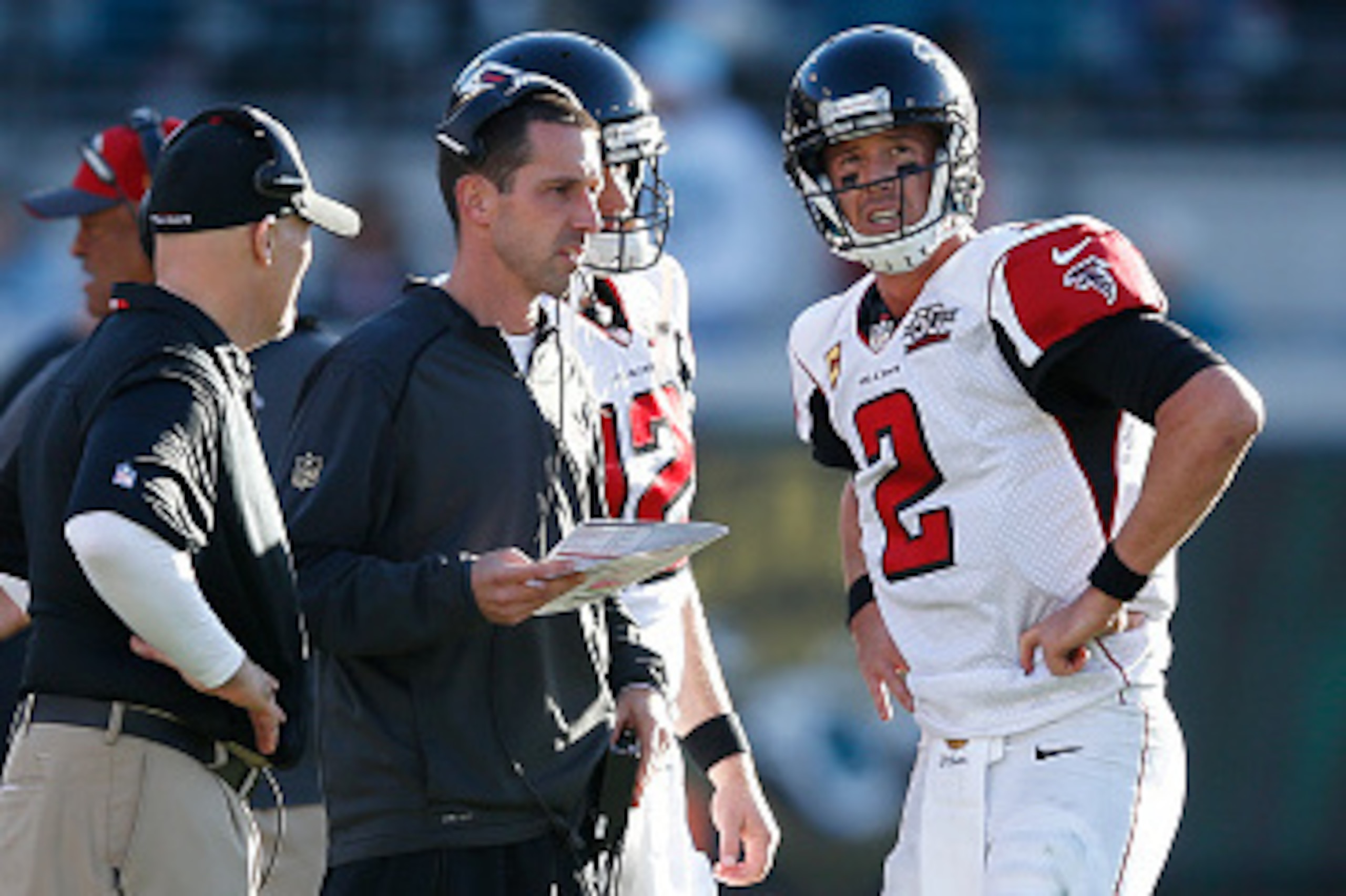JACKSONVILLE, FL - DECEMBER 20: Matt Ryan #2 of the Atlanta Falcons talks to offensive coordinator Kyle Shanahan and head coach Dan Quinn during the game against the Jacksonville Jaguars at EverBank Field on December 20, 2015 in Jacksonville, Florida. The