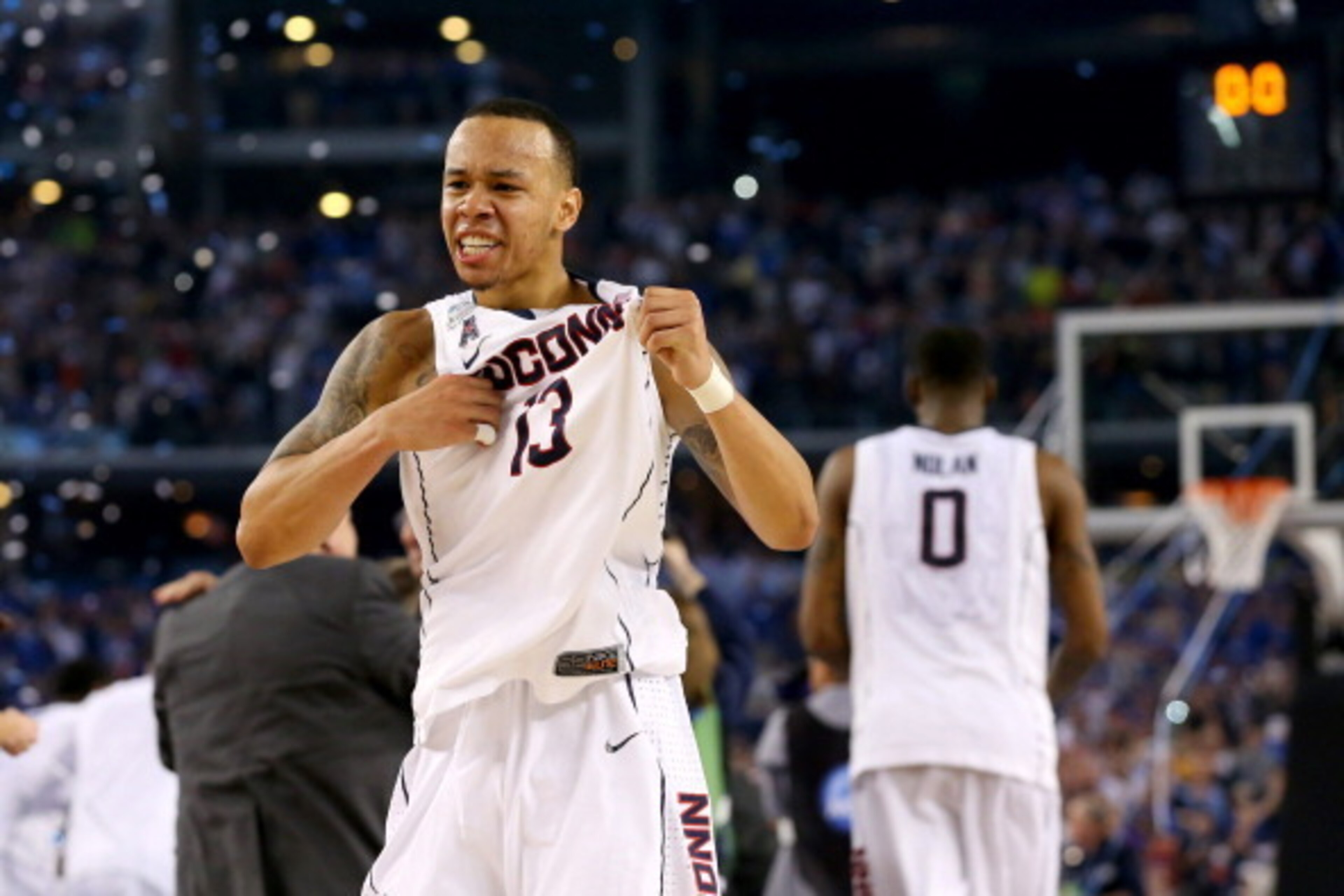 ARLINGTON, TX - APRIL 07: Shabazz Napier #13 of the Connecticut Huskies celebrates on the court after defeating the Kentucky Wildcats 60-54 in the NCAA Men's Final Four Championship at AT&T Stadium on April 7, 2014 in Arlington, Texas. (Photo by Ronald ARLINGTON, TX - APRIL 07: Shabazz Napier #13 of the Connecticut Huskies celebrates on the court after defeating the Kentucky Wildcats 60-54 in the NCAA Men's Final Four Championship at AT&T Stadium on April 7, 2014 in Arlington, Texas. (Photo by Ronald
