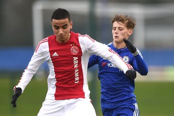 COBHAM, ENGLAND - MARCH 15: Kyle Scott of Chelsea and Ashraf El Mahdioui of Ajax in action during the UEFA Youth League quarter final match between Chelsea and Ajax at Chelsea Training Ground on March 15, 2016 in Cobham, England. (Photo by Tom Dulat/Getty