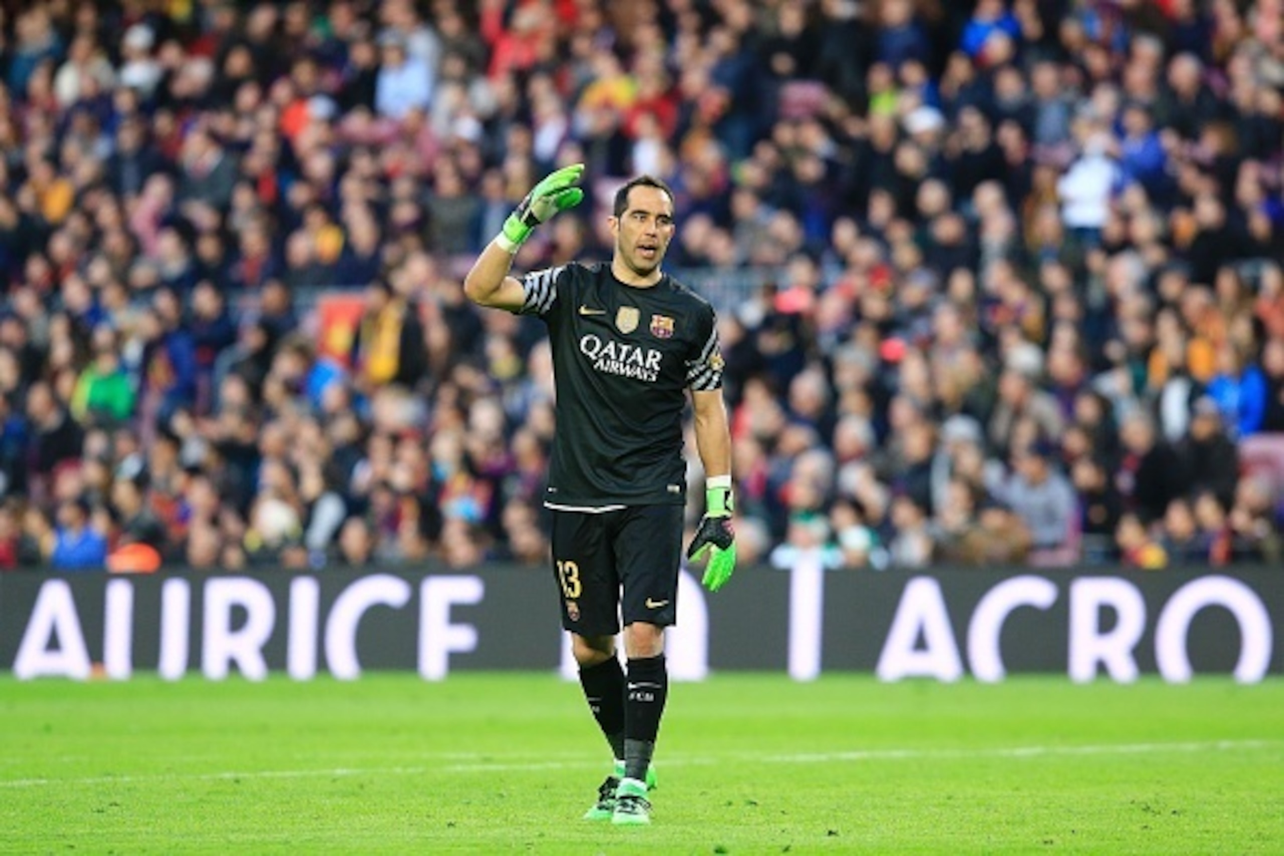 Barcelona's Chilean goalkeeper Claudio Bravo gestures after a failed attempt on goal by one of his teammates during the Spanish league football match FC Barcelona vs Club Atletico de Madrid at the Camp Nou stadium in Barcelona on January 30, 2016. Barcelo Barcelona's Chilean goalkeeper Claudio Bravo gestures after a failed attempt on goal by one of his teammates during the Spanish league football match FC Barcelona vs Club Atletico de Madrid at the Camp Nou stadium in Barcelona on January 30, 2016. Barcelo