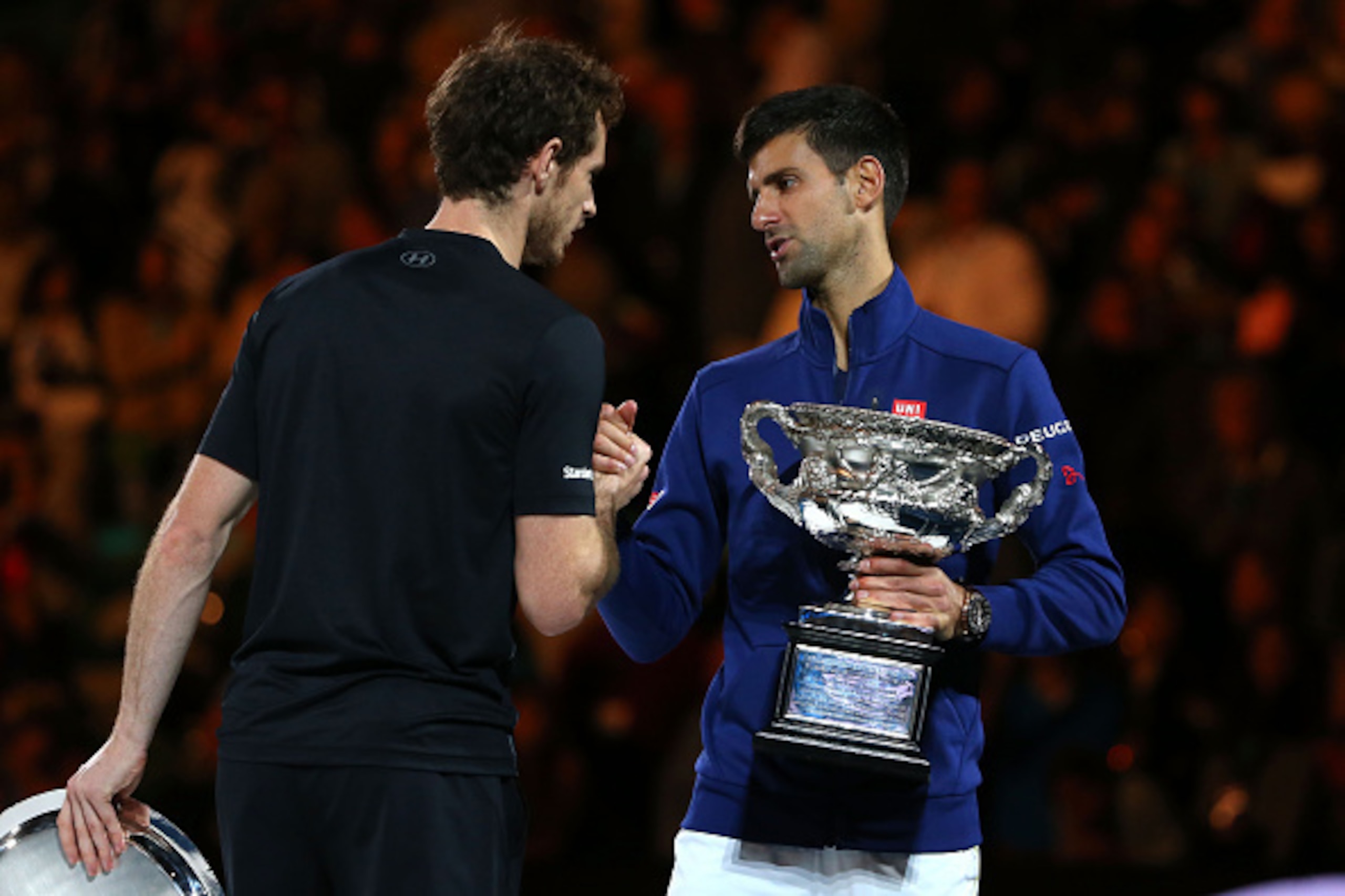 MELBOURNE, AUSTRALIA - JANUARY 31:  Australian Open champion Novak Djokovic of Serbia shakes hands with Andy Murray of Great Britain during the trophy presentation after the Men's Singles Final during day 14 of the 2016 Australian Open at Melbourne Park o