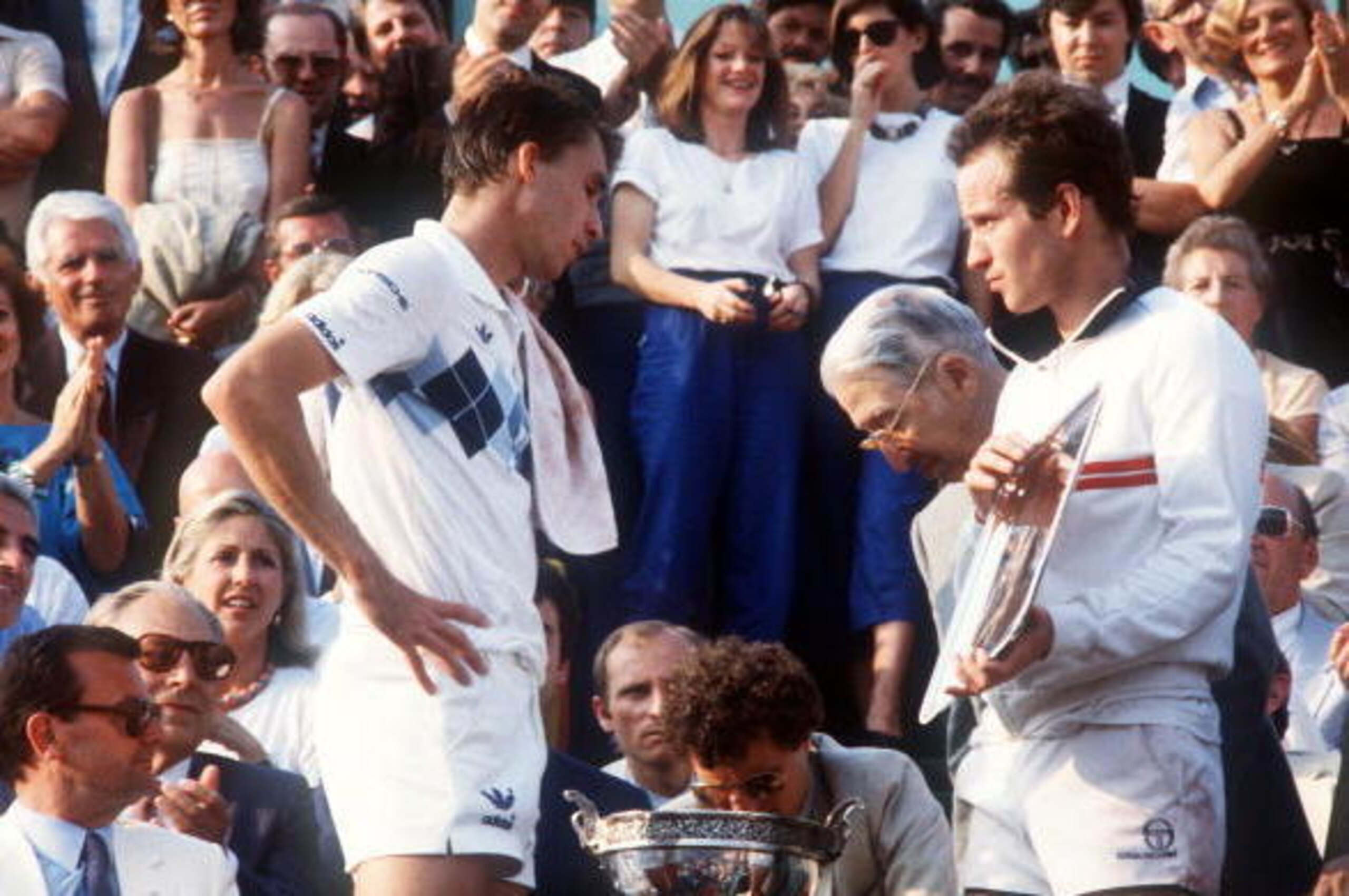 PARIS, FRANCE - JUNE 10:  American tennis player John McEnroe (R) holds the silver plate as Czekoslovakian player Ivan Lendl waits to receive the cup for his victory against top-seeded McEnroe in the men's final of the French Tennis Open in Roland Garros 