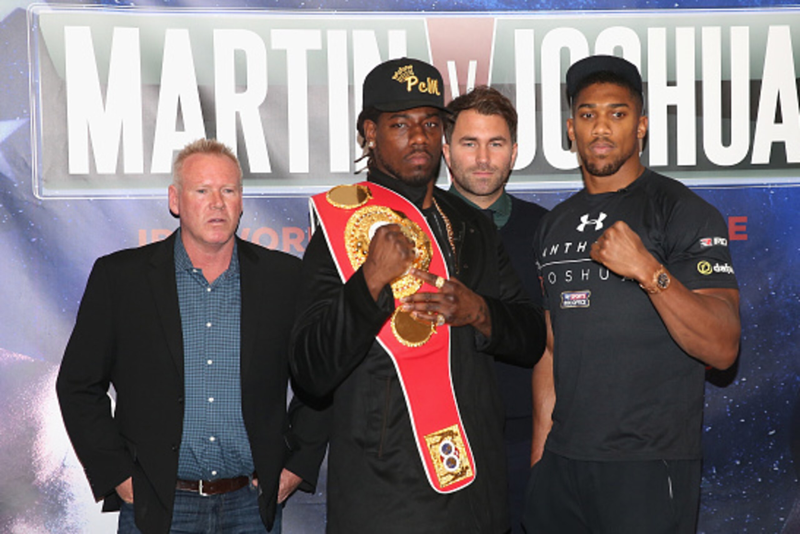 LONDON, ENGLAND - FEBRUARY 19:  (L-R) Paul Cain (Martin's trainer), Charles Martin of the USA, promoter Eddie Hearn and Anthony Joshua of England are pictured together during the Anthony Joshua and Charles Martin Press Conference at The Dorchester hotel o