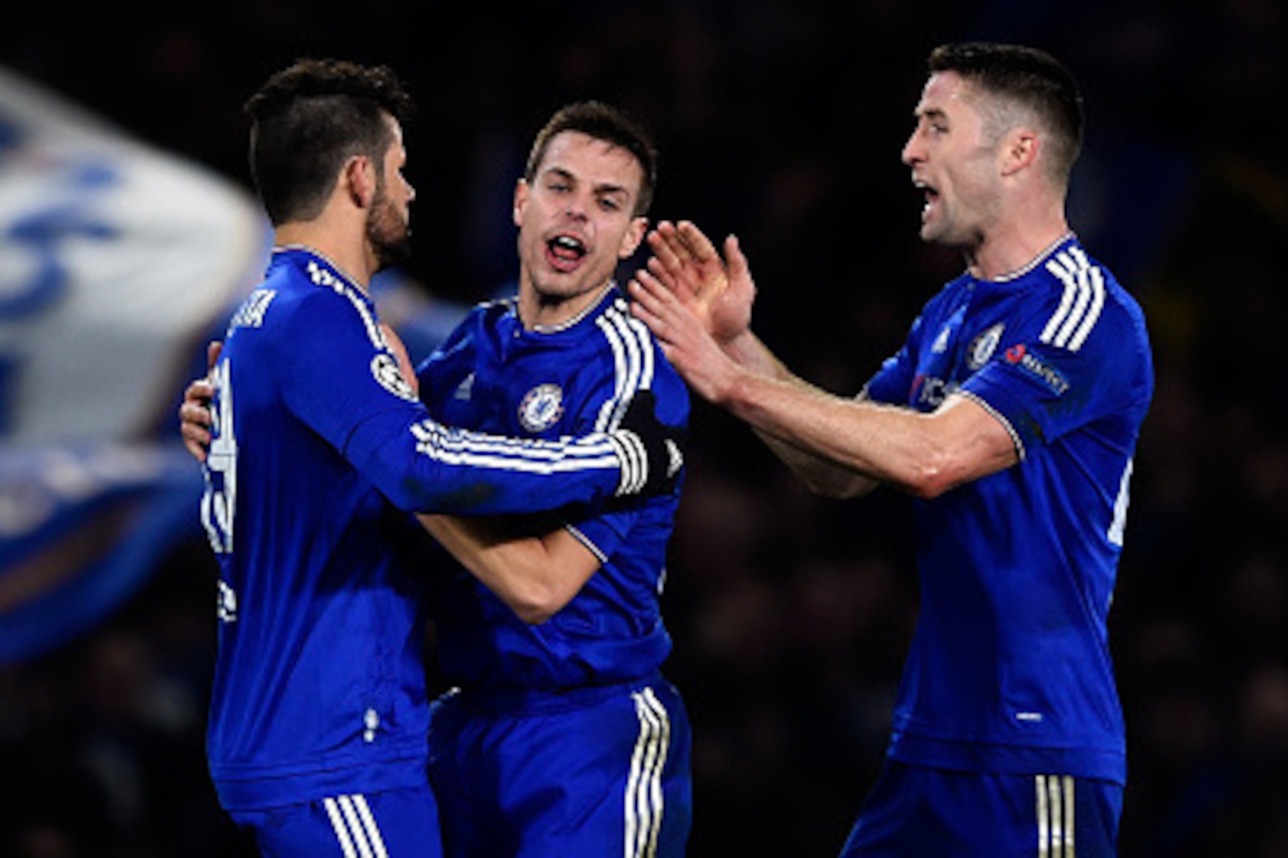 LONDON, ENGLAND - MARCH 09:  (L-R) Diego Costa of Chelsea is congratulated by teammates Cesar Azpilicueta and Gary Cahill after scoring a goal to level the scores at 1-1 during the UEFA Champions League round of 16, second leg match between Chelsea and Pa