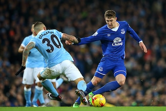 MANCHESTER, ENGLAND - JANUARY 27:  Nicolas Otamendi of Manchester City and John Stones of Everton compete for the ball during the Capital One Cup Semi Final, second leg match between Manchester City and Everton at the Etihad Stadium on January 27, 2016 in