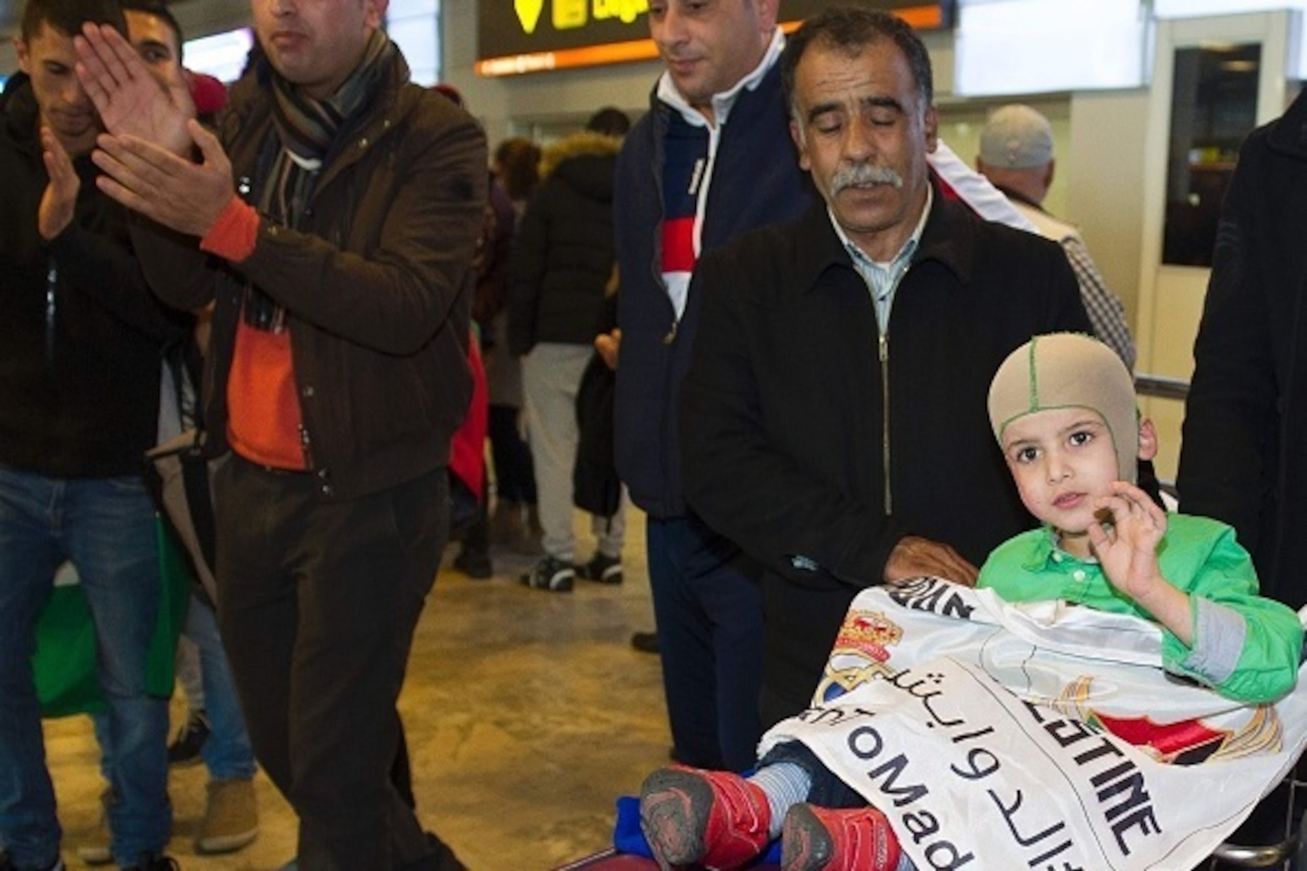 Five year old Palestinian boy who survived a firebombing by Jewish extremists that killed his parents and brother Ahmed Dawabsha (C) arrives at Adolfo Suarez Airport near Madrid on March 6, 2016 priot to meeting Real Madrid football stars including his id Five year old Palestinian boy who survived a firebombing by Jewish extremists that killed his parents and brother Ahmed Dawabsha (C) arrives at Adolfo Suarez Airport near Madrid on March 6, 2016 priot to meeting Real Madrid football stars including his id