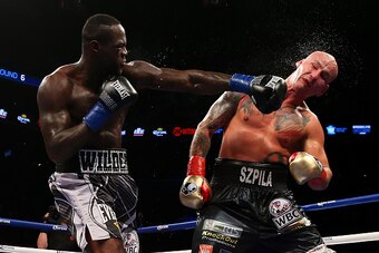 NEW YORK, NY - JANUARY 16:  Deontay Wilder punches Artur Szpilka during their WBC Heavyweight Championship bout at Barclays Center on January 16, 2016 in Brooklyn borough of New York City.  (Photo by Mike Stobe/Getty Images)
