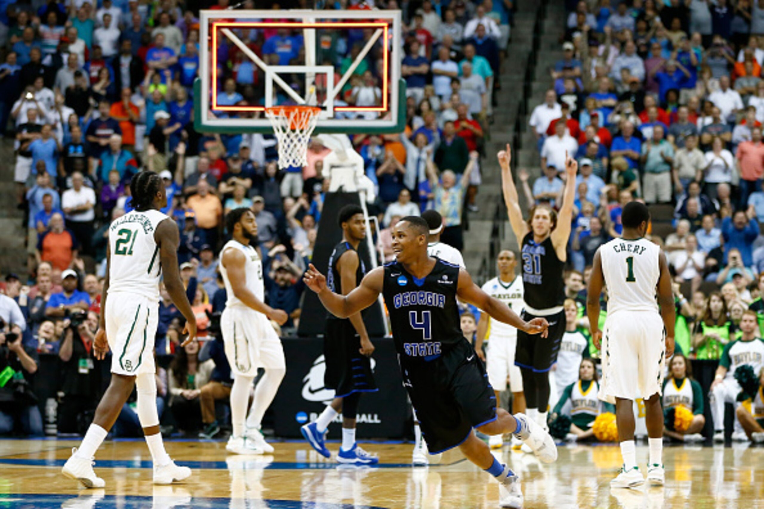 JACKSONVILLE, FL - MARCH 19:  Isaiah Dennis #4 and T.J. Shipes #31 of the Georgia State Panthers celebrate after the Panthers win 57-56 against the Baylor Bears in the second round of the 2015 NCAA Men's Basketball Tournament at Jacksonville Veterans Memo
