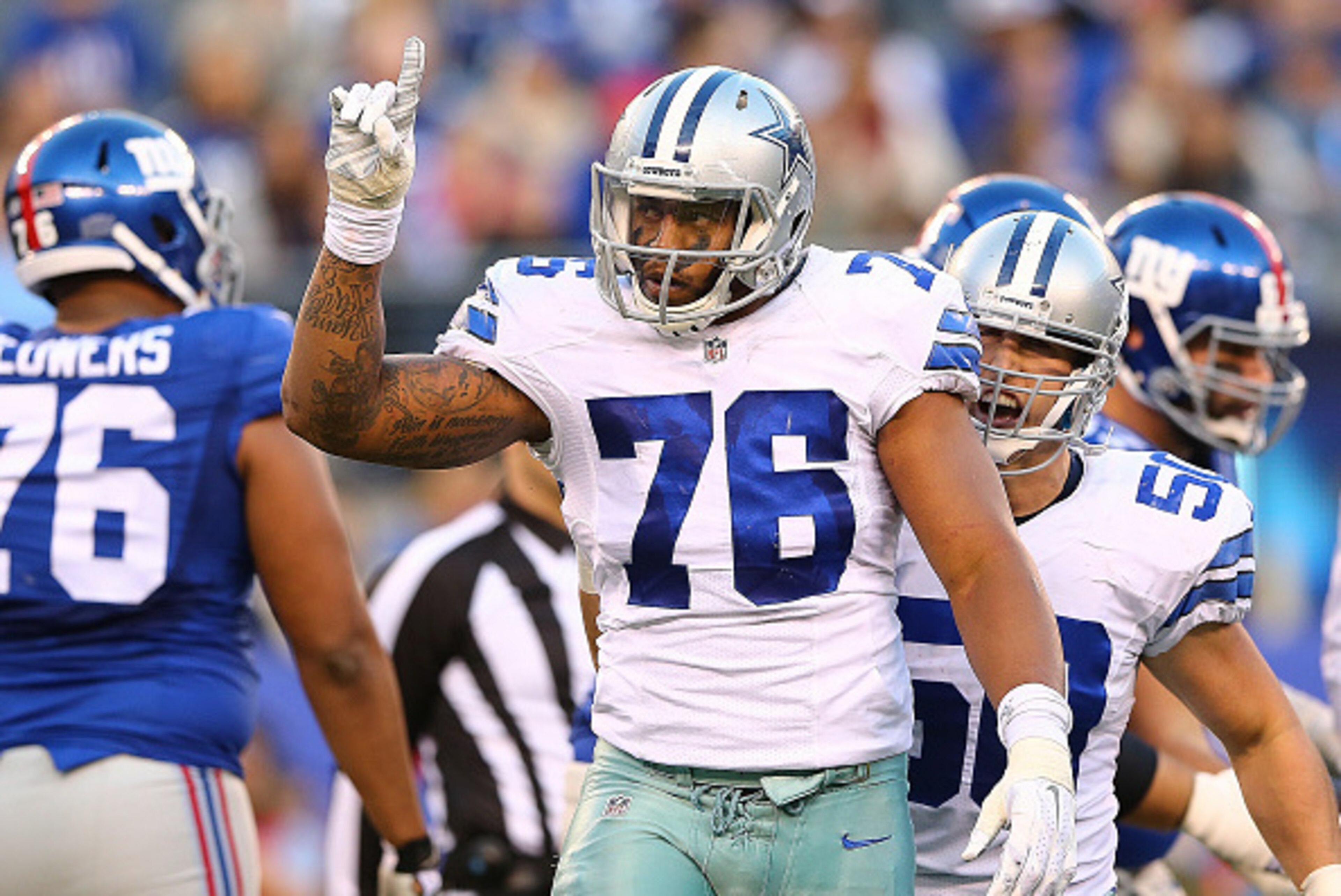EAST RUTHERFORD, NJ - OCTOBER 25:  Greg Hardy #76 of the Dallas Cowboys celebrates a sack during the second quarter against the New York Giants at MetLife Stadium on October 25, 2015 in East Rutherford, New Jersey.  (Photo by Elsa/Getty Images)