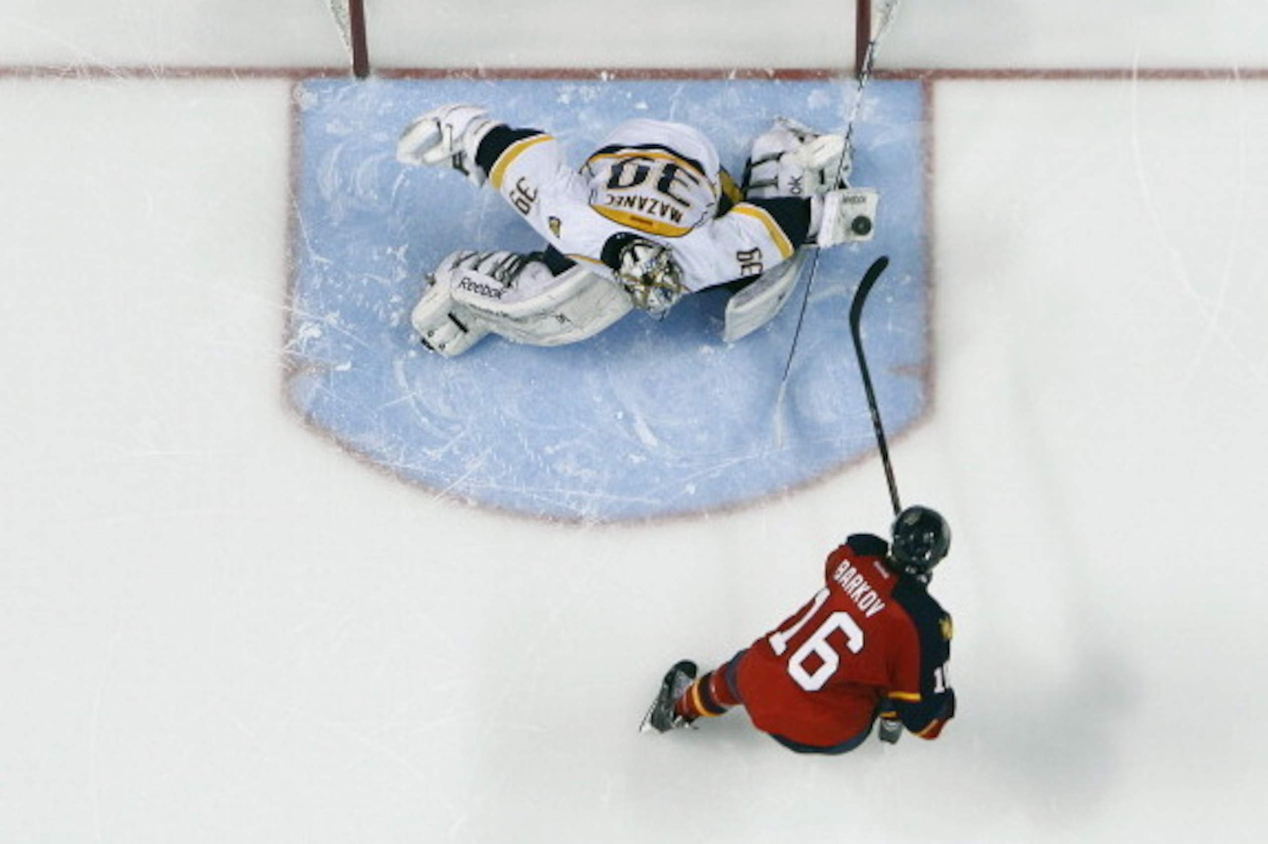 SUNRISE, FL - JANUARY 4: Goaltender Marek Mazanec #39 of the Nashville Predators stops the shot by Aleksander Barkov #16 of the Florida Panthers during the shootout at the BB&T Center on January 4, 2014 in Sunrise, Florida. The Panthers defeated the Preda