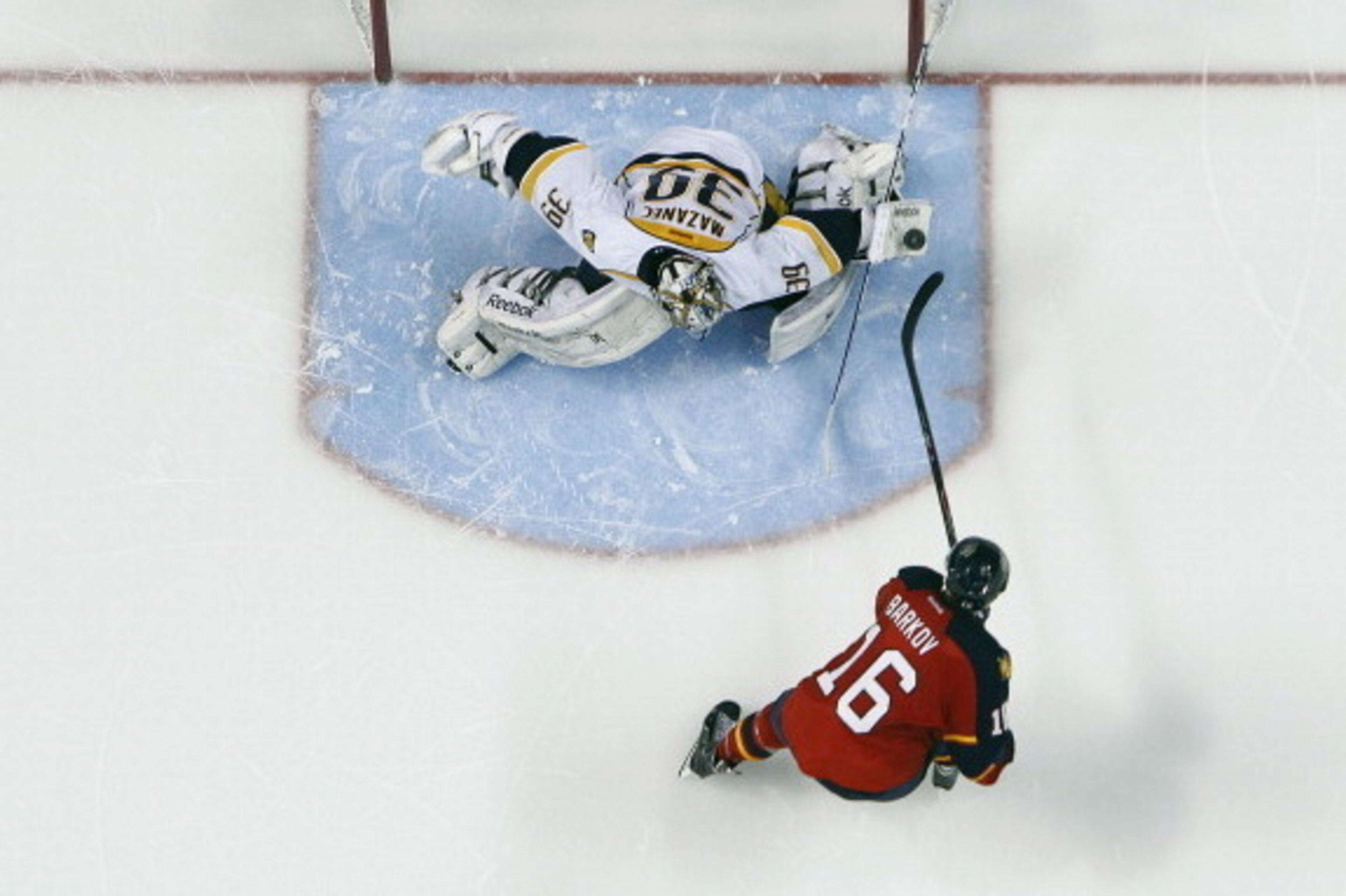 SUNRISE, FL - JANUARY 4: Goaltender Marek Mazanec #39 of the Nashville Predators stops the shot by Aleksander Barkov #16 of the Florida Panthers during the shootout at the BB&T Center on January 4, 2014 in Sunrise, Florida. The Panthers defeated the Preda SUNRISE, FL - JANUARY 4: Goaltender Marek Mazanec #39 of the Nashville Predators stops the shot by Aleksander Barkov #16 of the Florida Panthers during the shootout at the BB&T Center on January 4, 2014 in Sunrise, Florida. The Panthers defeated the Preda