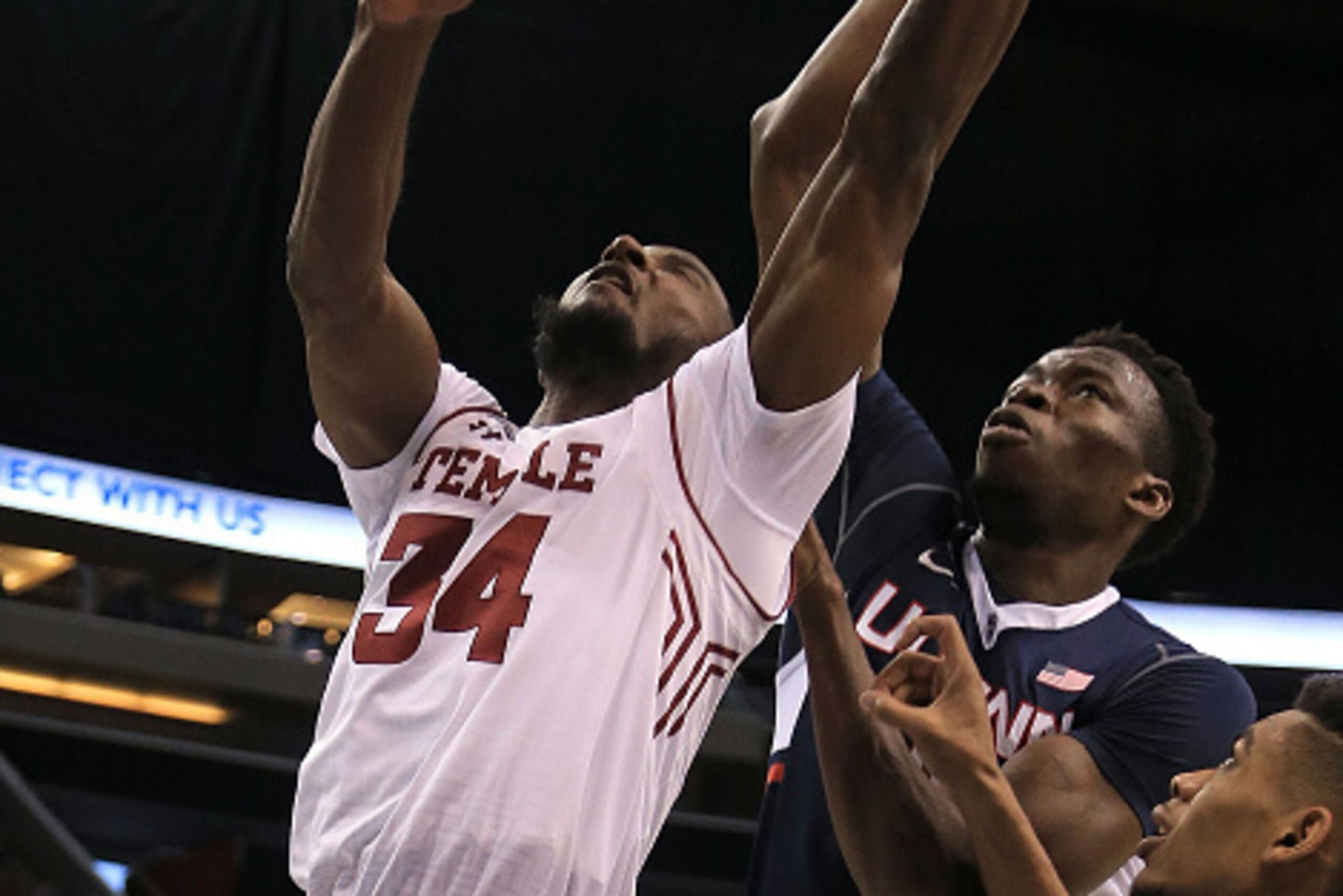 ORLANDO, FL - MARCH 12: Devin Coleman #34 of the Temple Owls goes up against Amida Brimah #35 of the Connecticut Huskies during a semifinal game of the 2016 AAC Basketball Tournament at Amway Center on March 12, 2016 in Orlando, Florida.  (Photo by Mike E