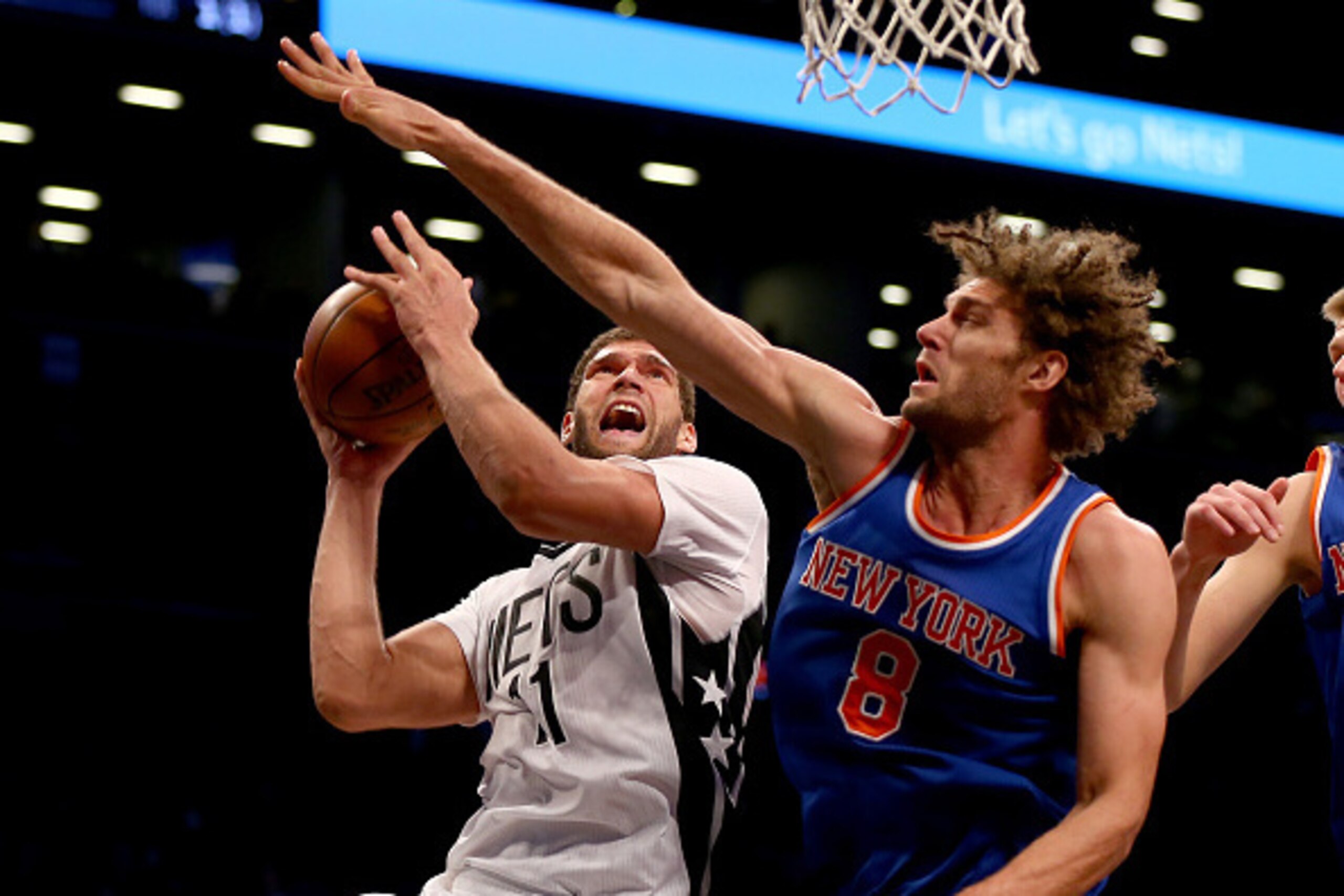 NEW YORK, NY - FEBRUARY 19:  Brook Lopez #11 of the Brooklyn Nets heads for the net as Robin Lopez #8 of the New York Knicks defends at Barclays Center on February 19, 2016 in the Brooklyn borough of New York City.The Brooklyn Nets defeated the Brooklyn N
