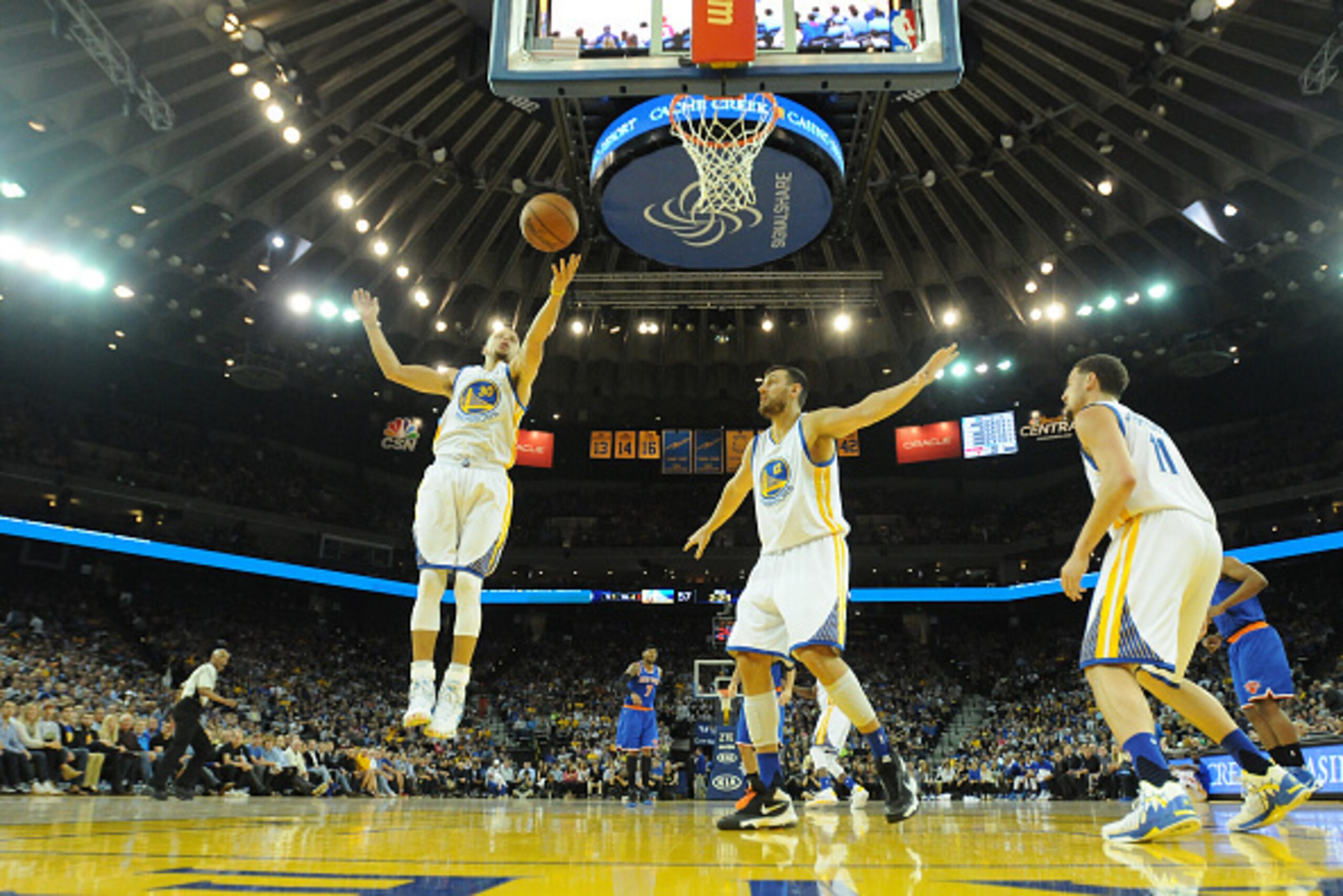 OAKLAND, CA - MARCH 16: Stephen Curry #30 of the Golden State Warriors rebounds against the New York Knicks on March 16, 2016 at Oracle Arena in Oakland, California. NOTE TO USER: User expressly acknowledges and agrees that, by downloading and or using th